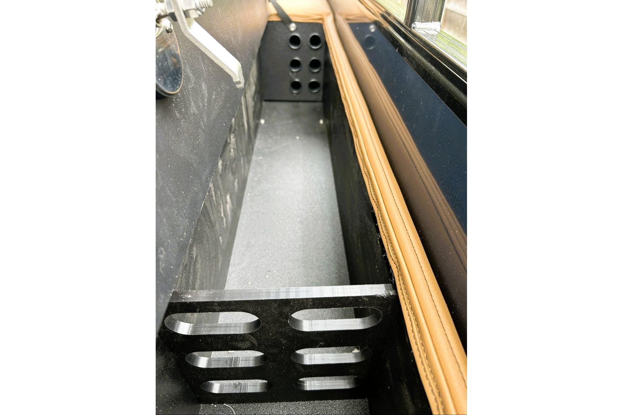 Interior detail of 2026 Ranger 220FC, featuring sleek black and tan design elements.