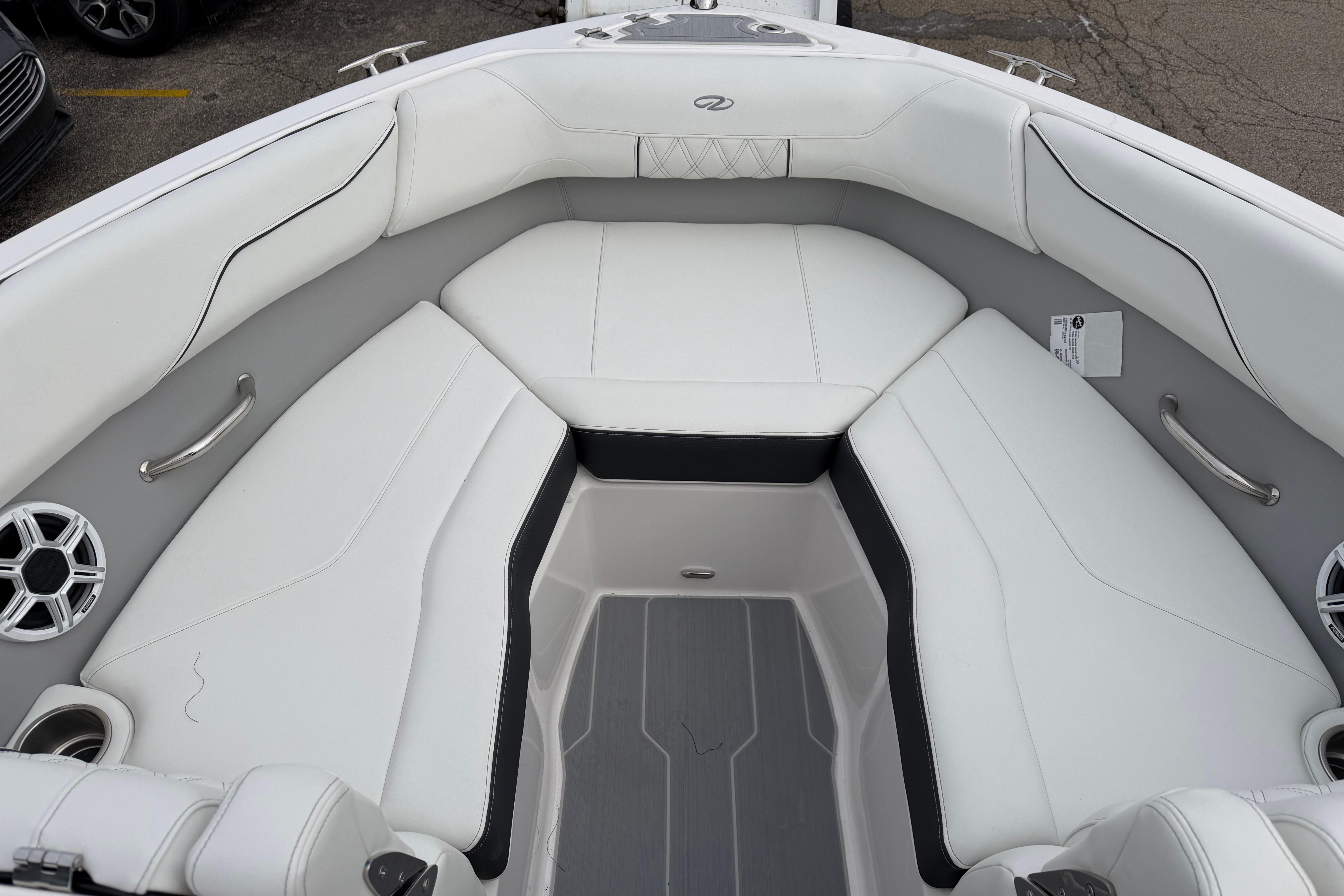 Interior of 2026 Regal LS2 Surf boat with white seating and modern design.