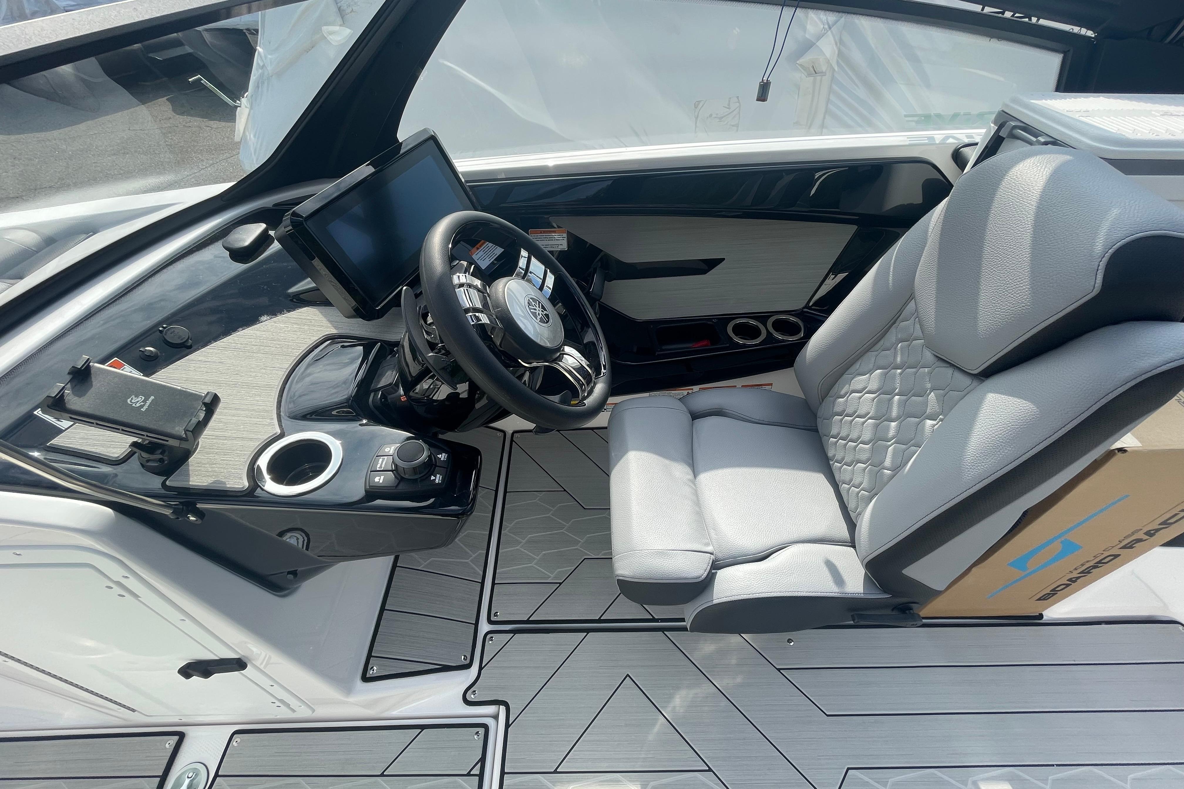 2026 Yamaha Boats 222XD cockpit with modern steering and comfortable seating.
