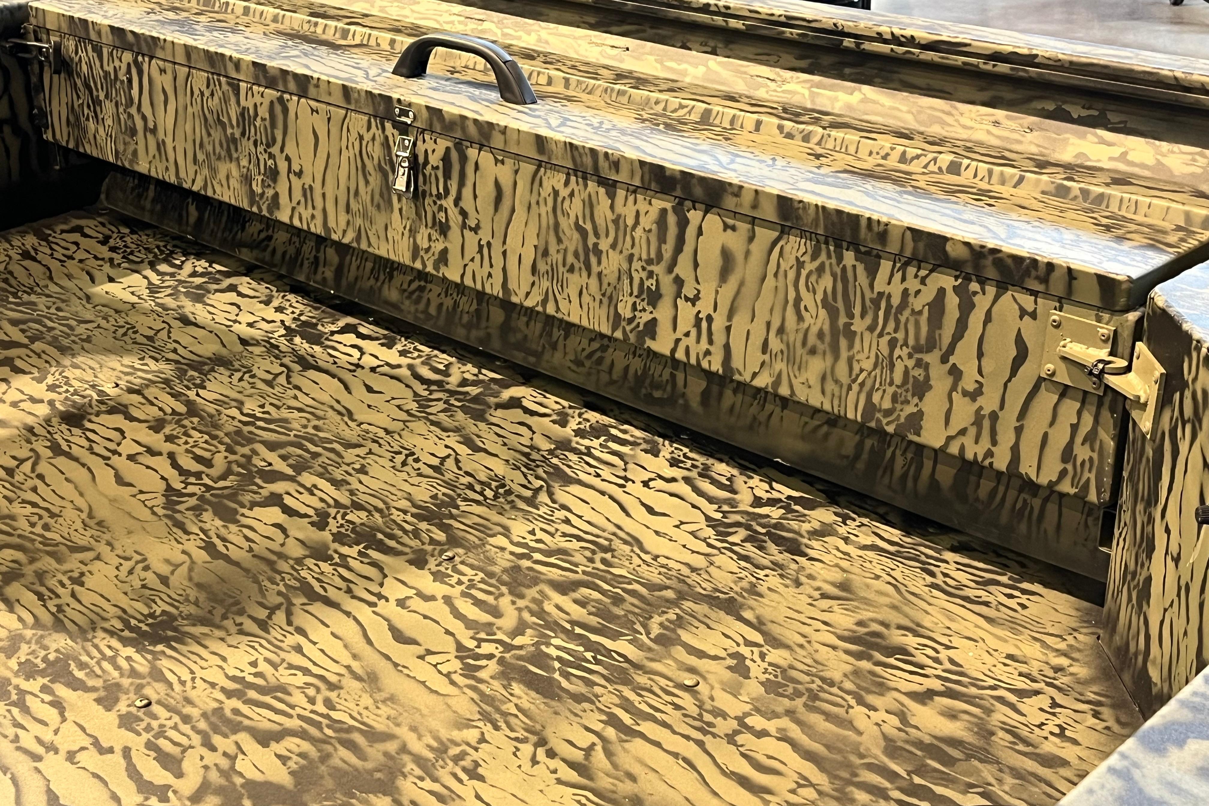 2026 Tracker Grizzly 1654 T Sportsman boat with camouflage interior design.