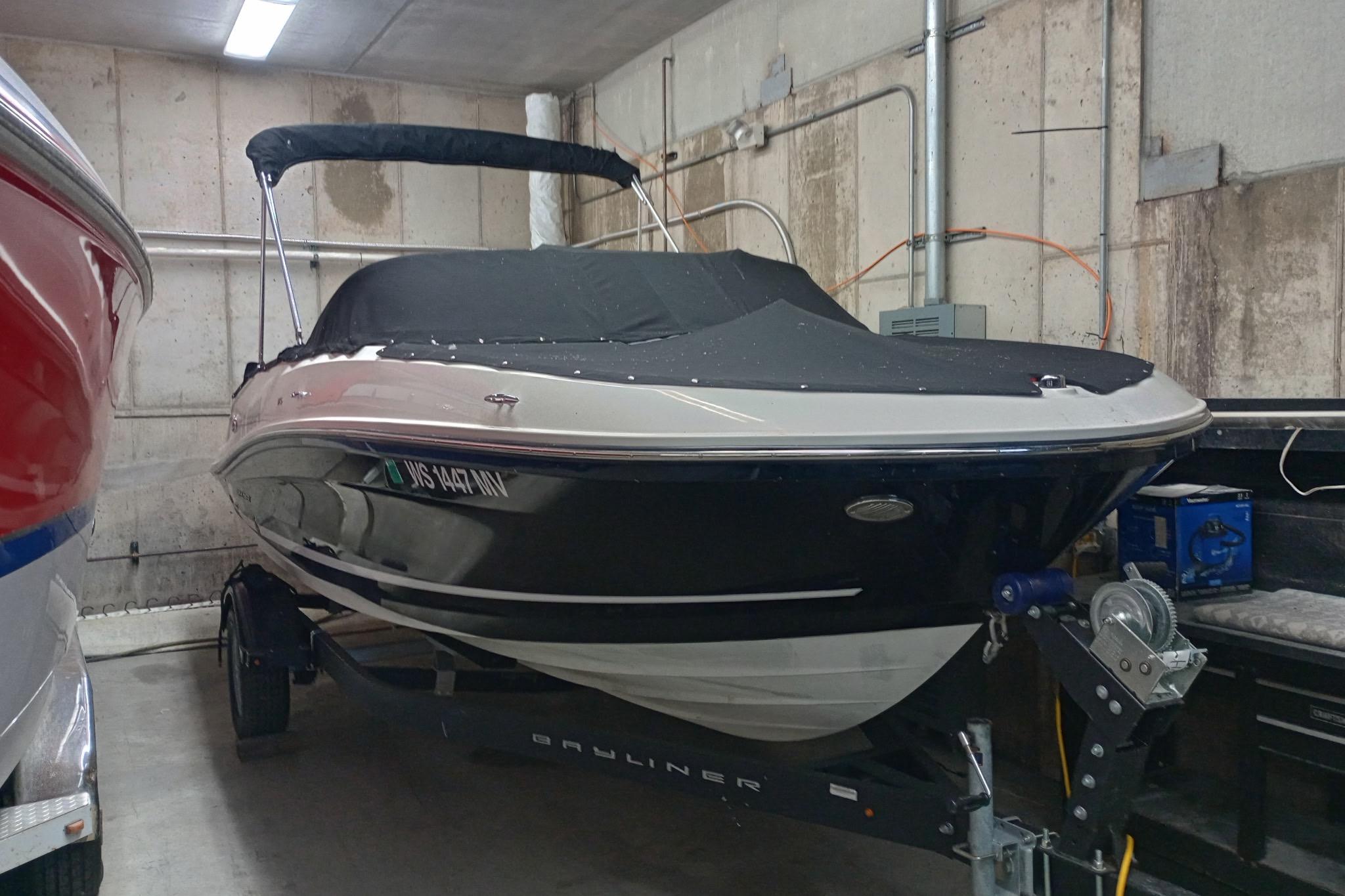 2022 Bayliner VR5 Bowrider I/O boat in storage, covered and on a trailer.
