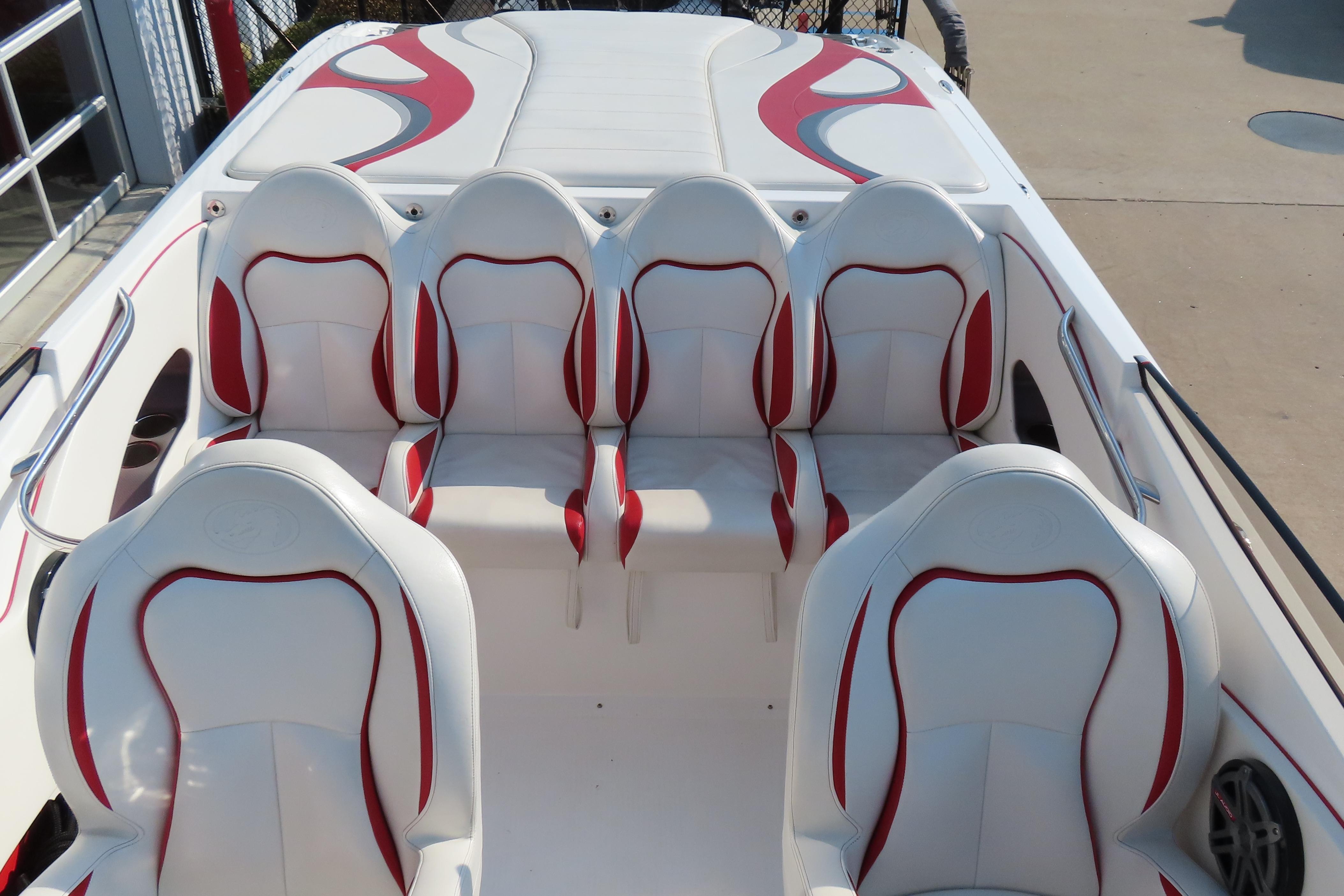 2013 Nordic 39 POKER RUN boat interior with white and red seating arrangement.