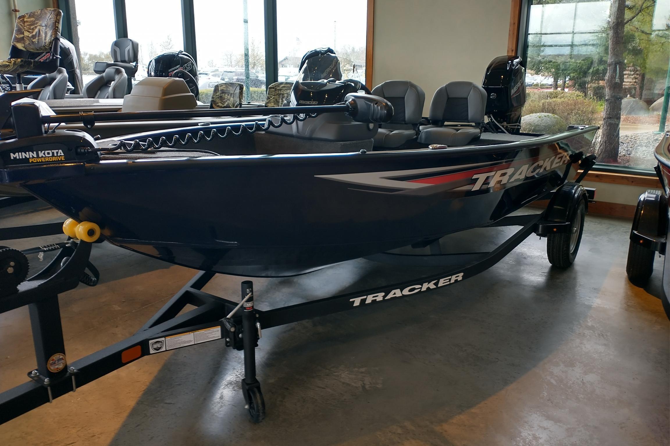 2026 Tracker Super Guide V-16 SC boat displayed indoors on a trailer.