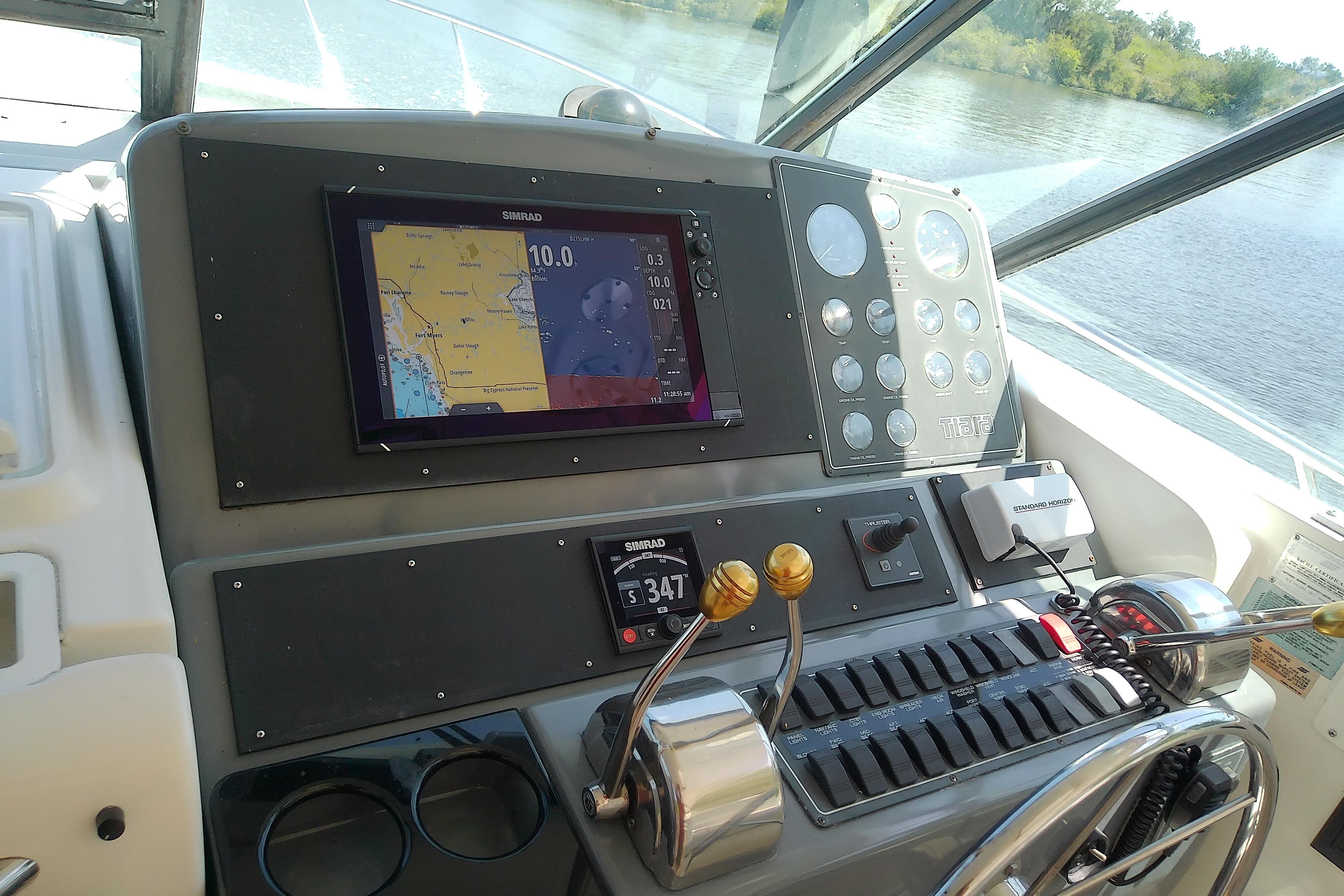 Cockpit of 2000 Tiara Yachts 4100 Open with navigation display and controls.