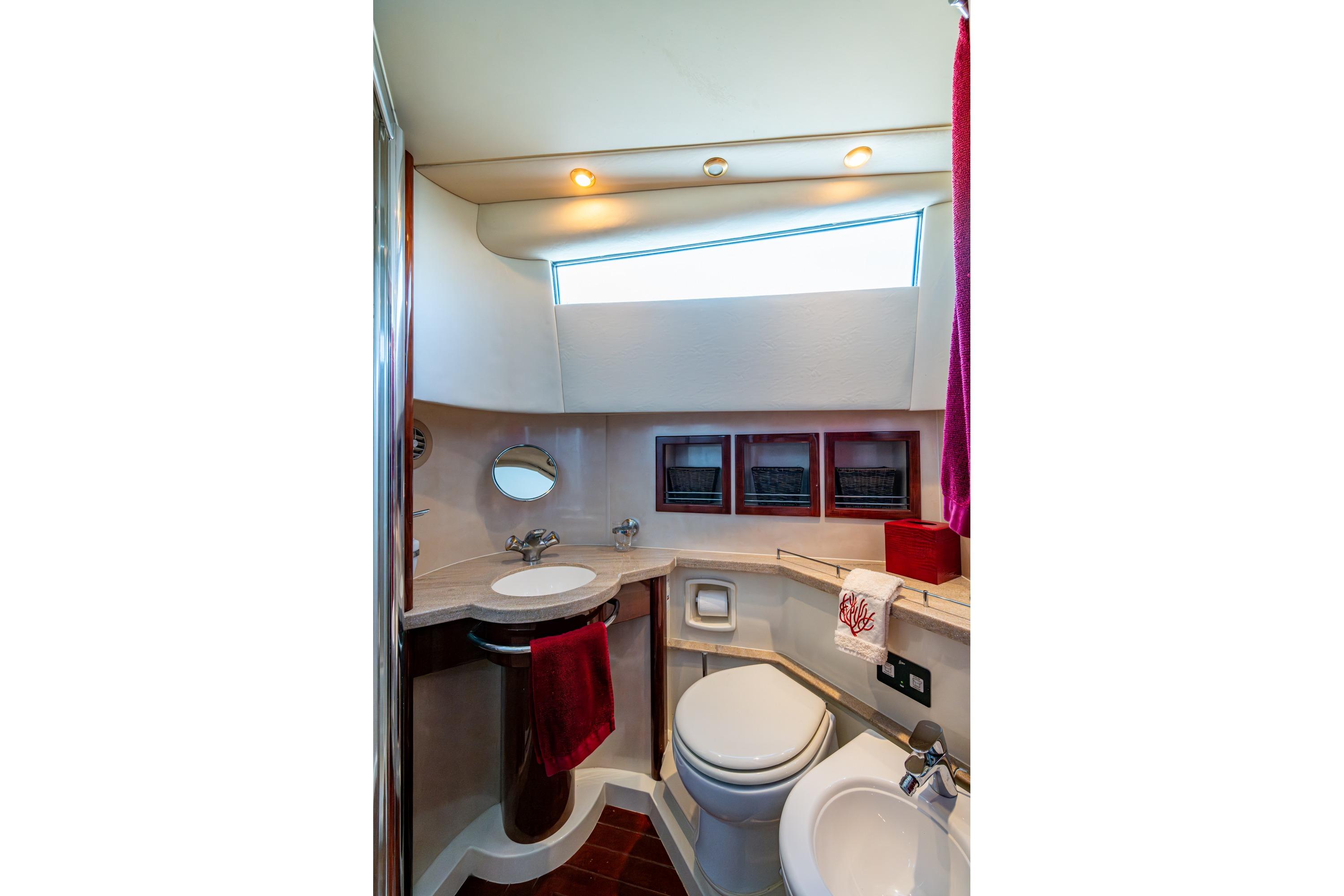 Luxurious bathroom in 2000 Fairline Squadron 52 yacht, featuring modern fixtures and elegant design.