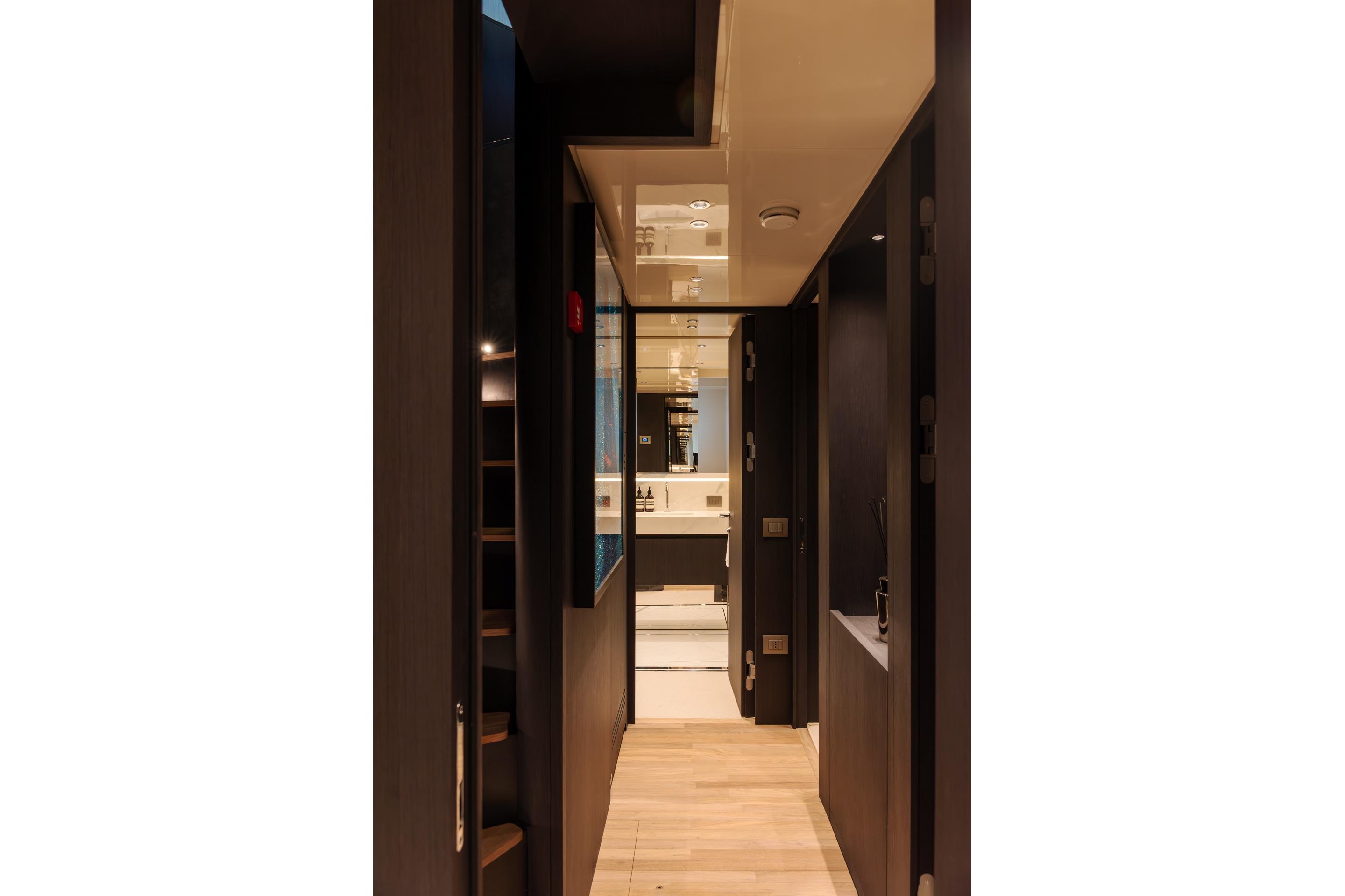 Luxurious interior hallway of 2025 Sanlorenzo SD118 yacht, featuring modern design and elegant lighting.