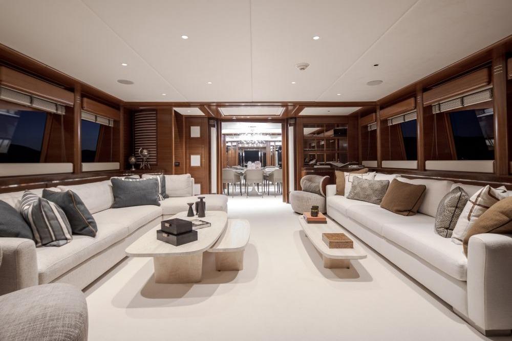Luxurious interior of 2009 CRN 129 yacht with elegant seating and modern decor.