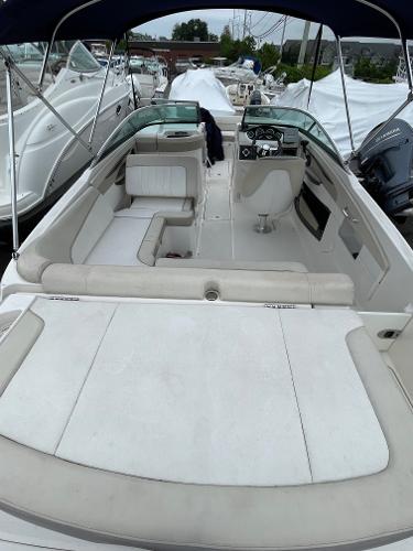 2013 Sea Ray 240 Sundeck boat with spacious seating and sleek design.