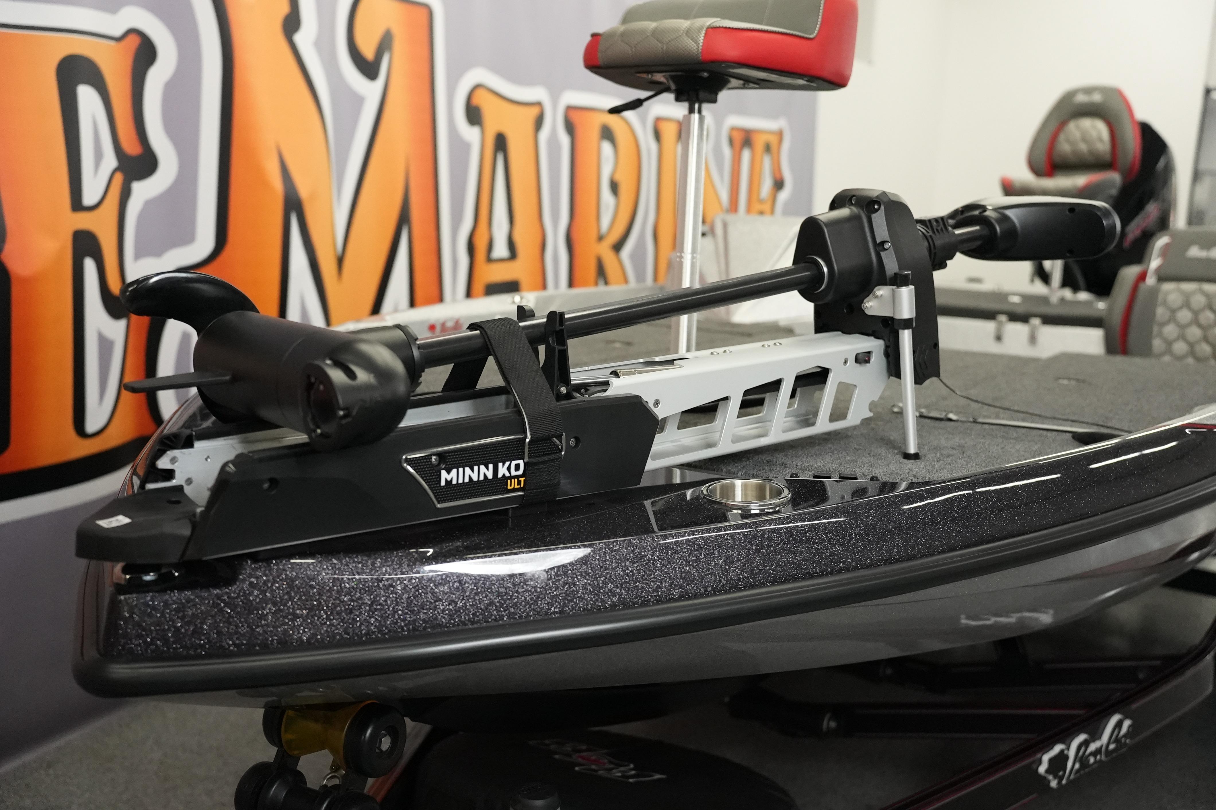2026 Bass Cat Lynx STS boat with Minn Kota trolling motor in showroom.