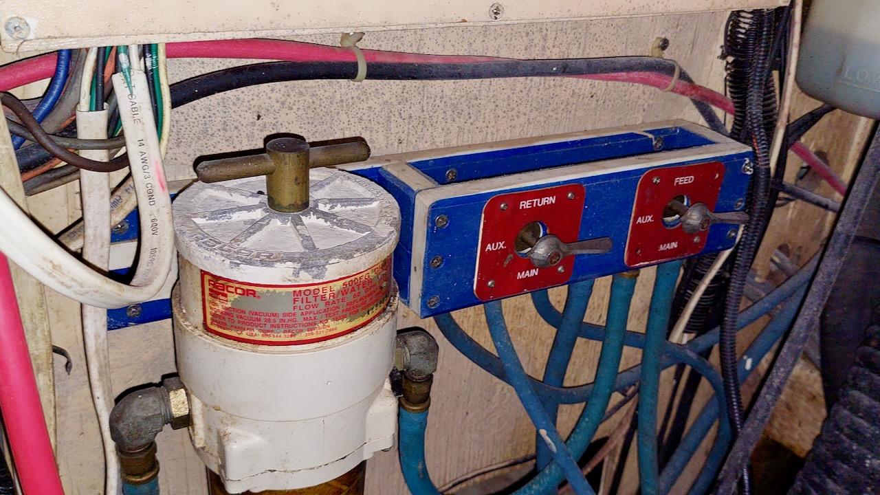 1981 Morgan Out Island 41 engine room with fuel filter and control panel.