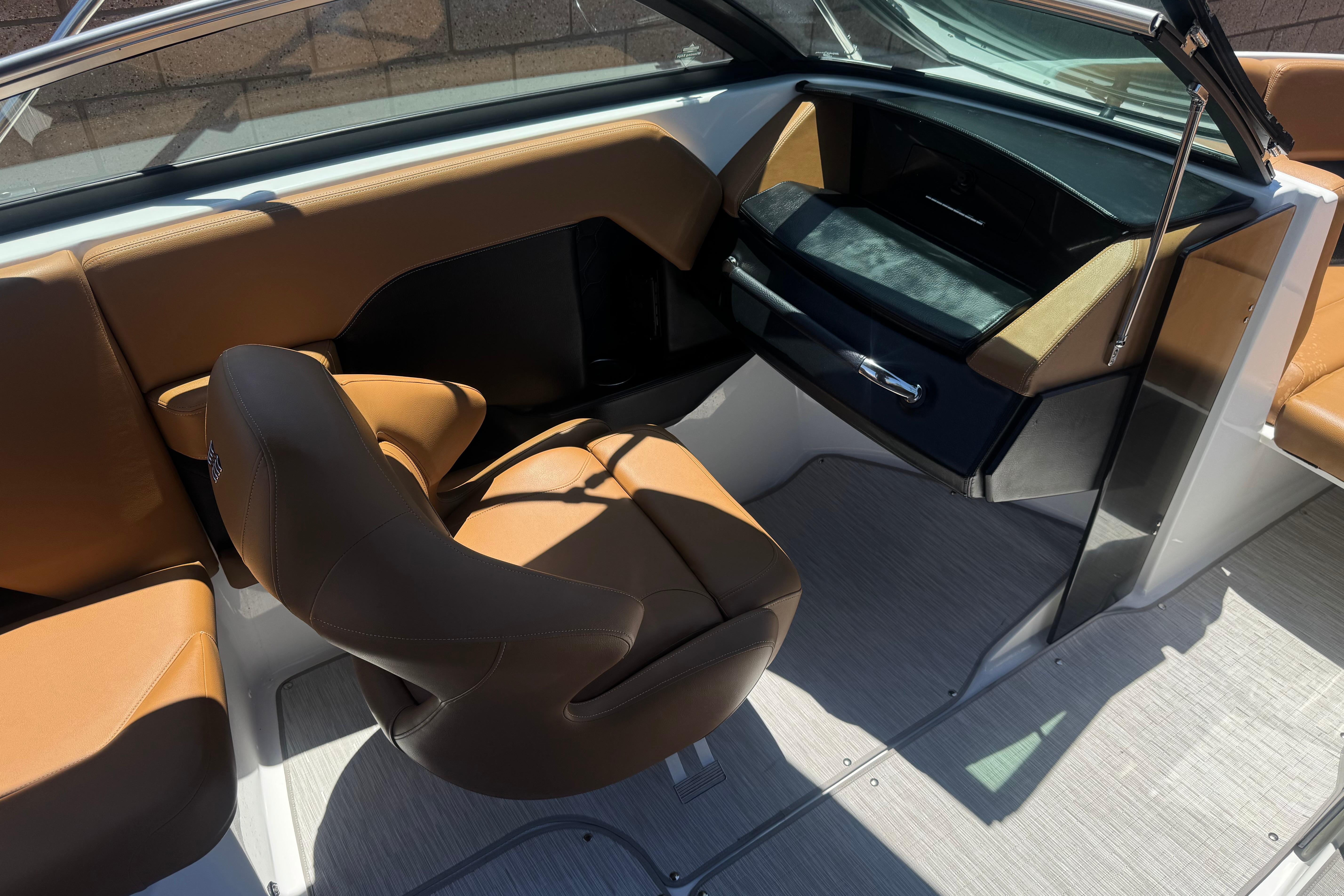 Interior of 2022 Four Winns H4 boat with tan seating and modern design.