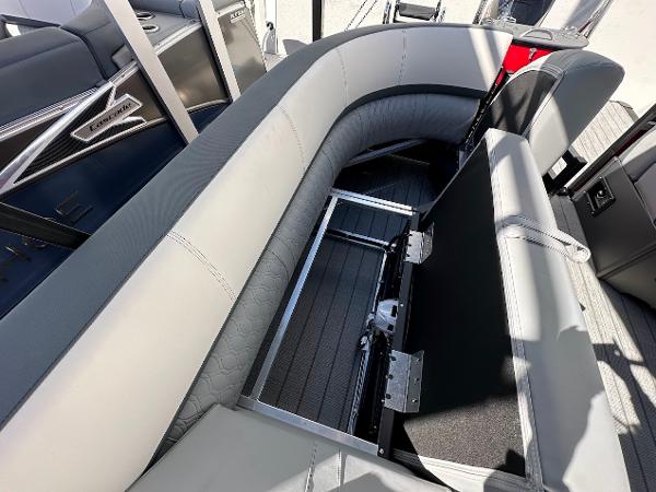 2025 Tahoe Pontoon 2585 LTZ Entertainer with open storage compartment and sleek seating design.