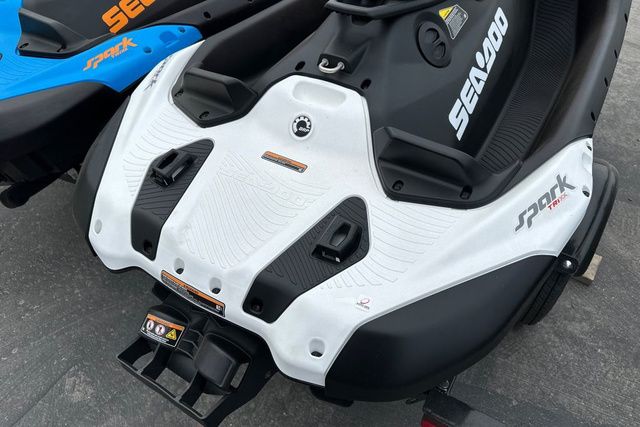 Close-up of a Sea-Doo SPARK TRIXX 90 jet ski with white and black design.
