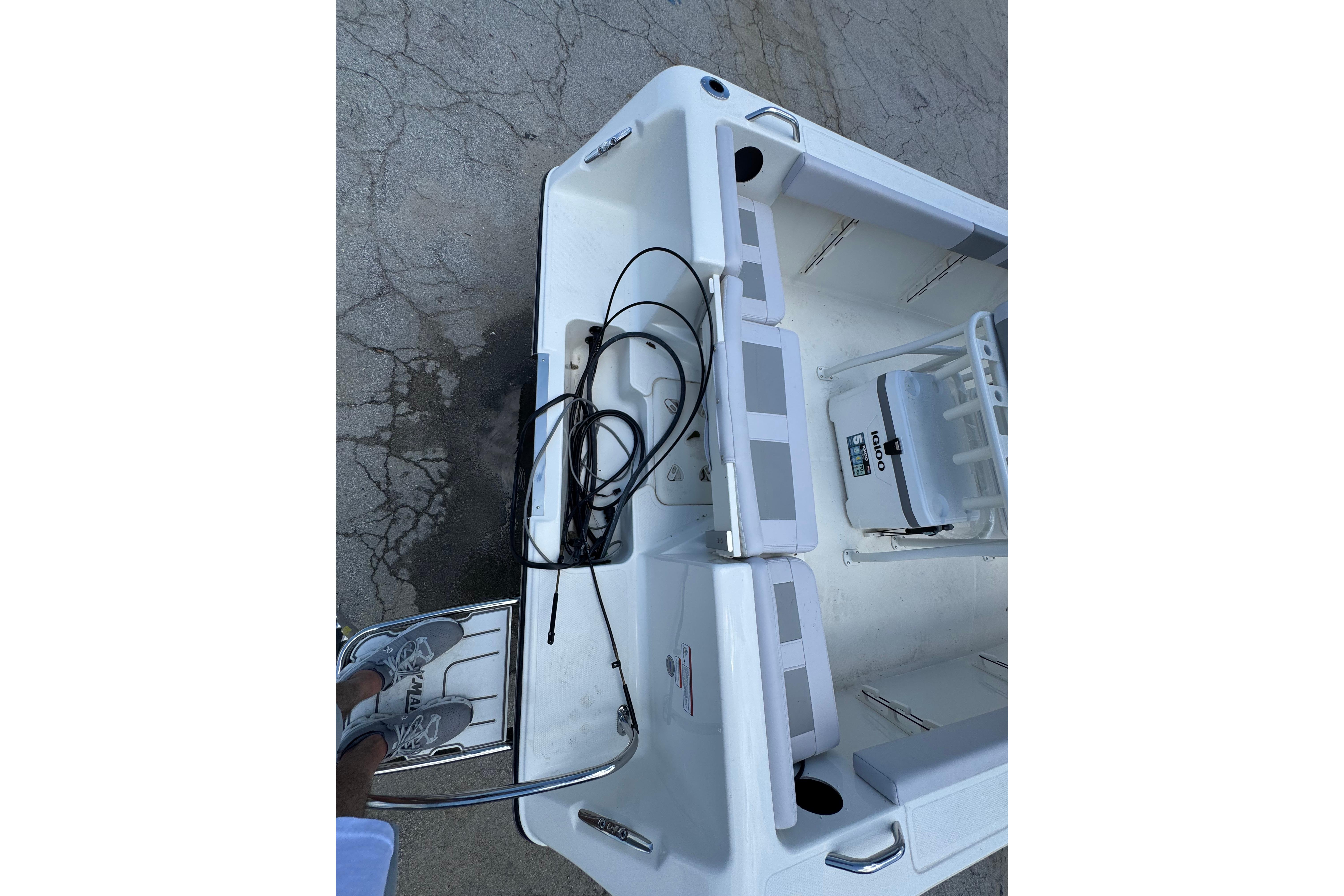 2026 Mako 214 Center Console boat interior with seating and equipment.
