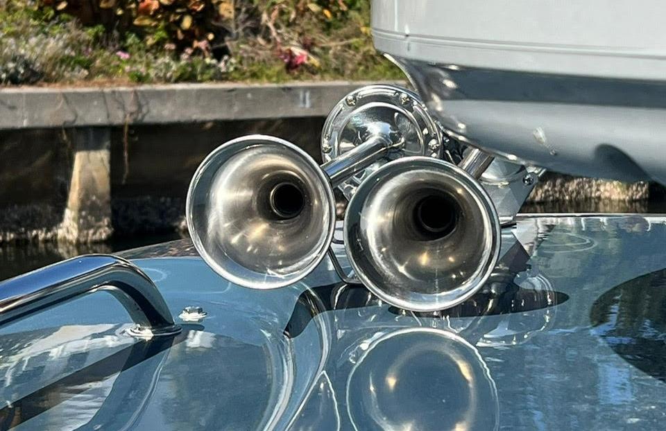 Close-up of dual chrome horns on a 2000 Protector Targa 28 boat.