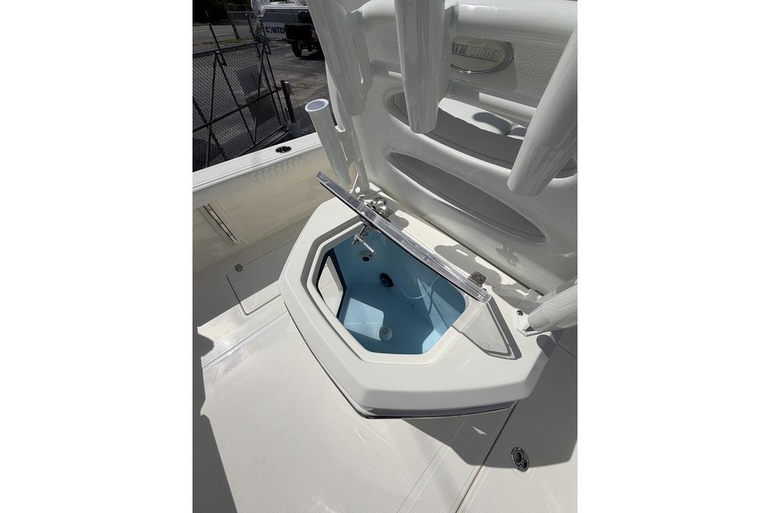 Open storage compartment on 2026 Pathfinder 2800 Hybrid boat deck.
