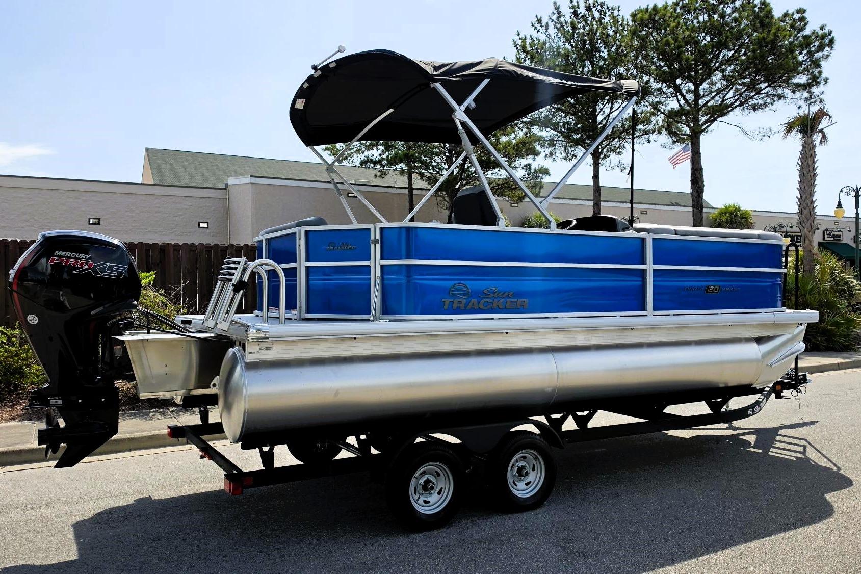 2026 Sun Tracker Party Barge 20 DLX pontoon boat with Mercury Pro XS engine.