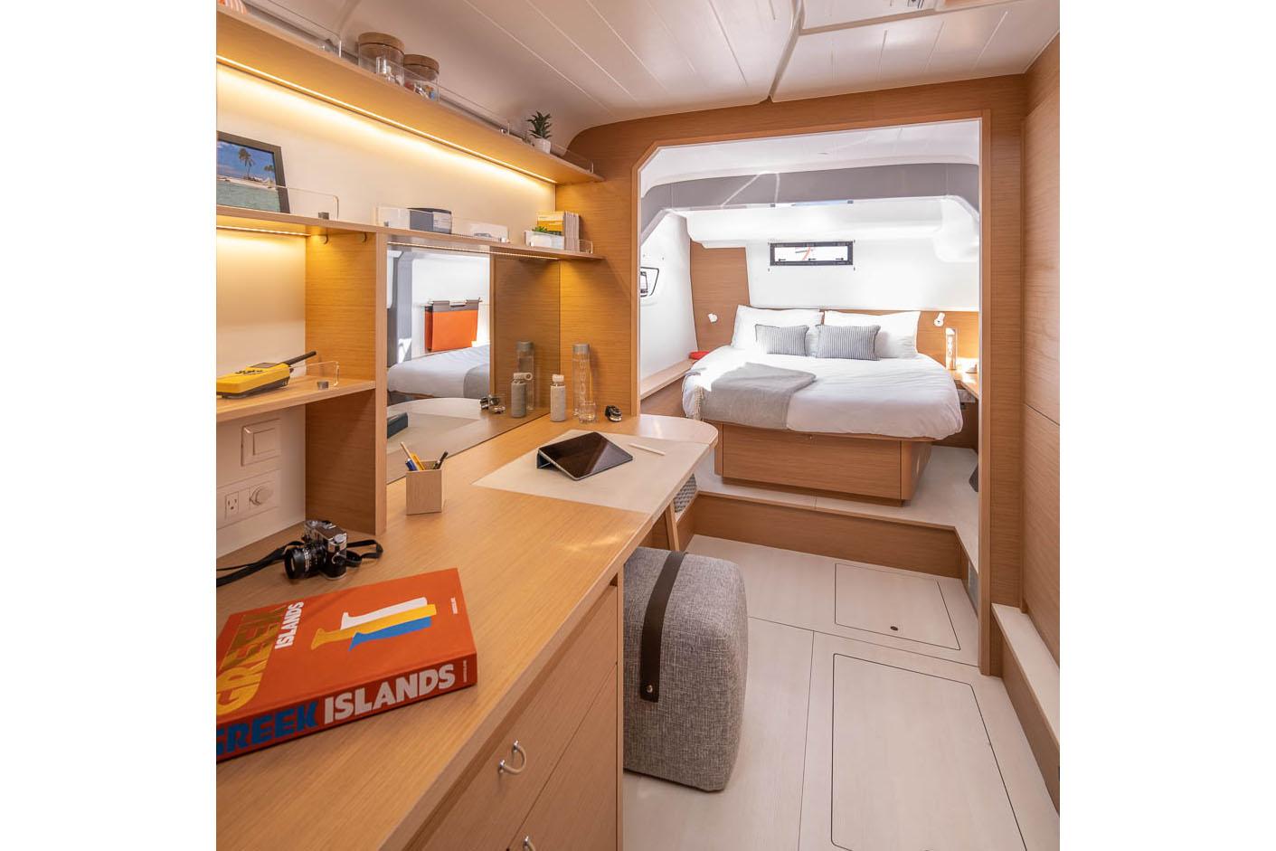 Manufacturer Provided Image: Luxurious interior of 2026 Excess 14 yacht with modern bedroom and workspace.