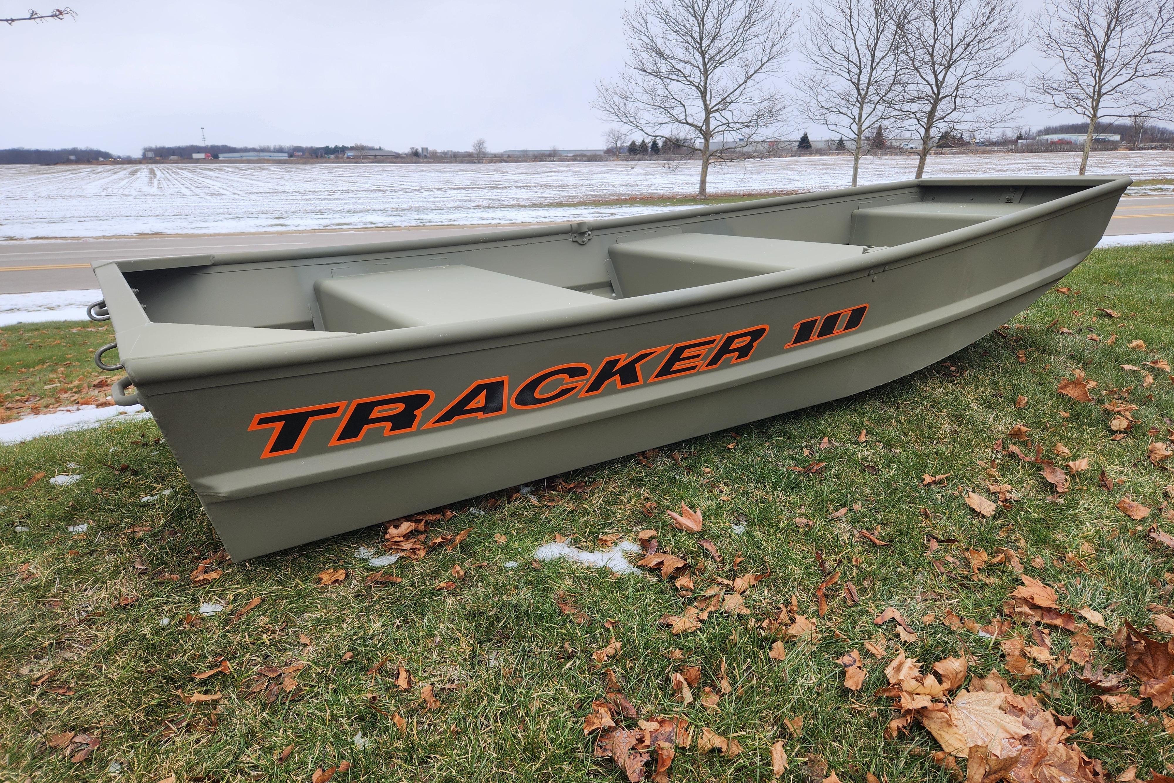 2026 Tracker Grizzly 10 Jon boat on grassy field with autumn leaves.