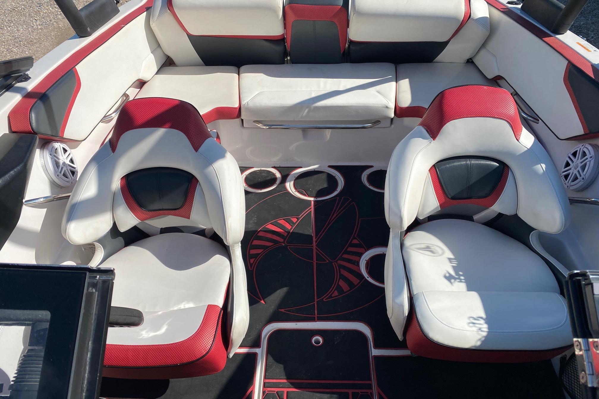 Interior of 2014 Scarab 195 H.O. Impulse boat with red and white seating.