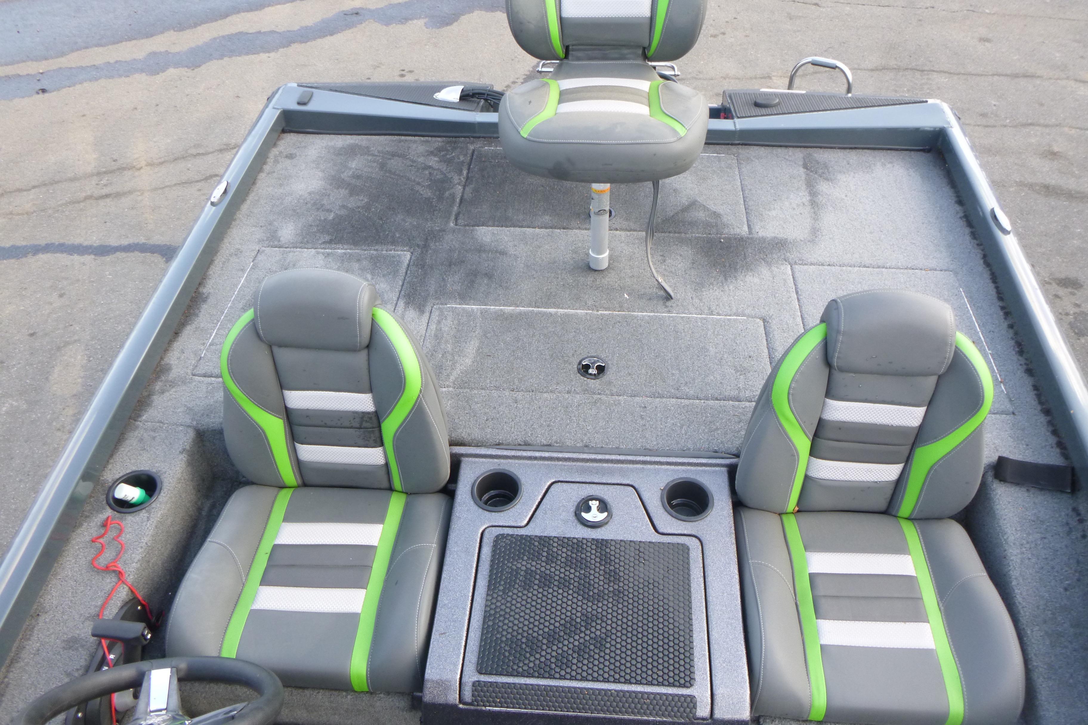 2023 Ranger RT198P boat interior with gray and green seating, steering wheel, and storage compartments.
