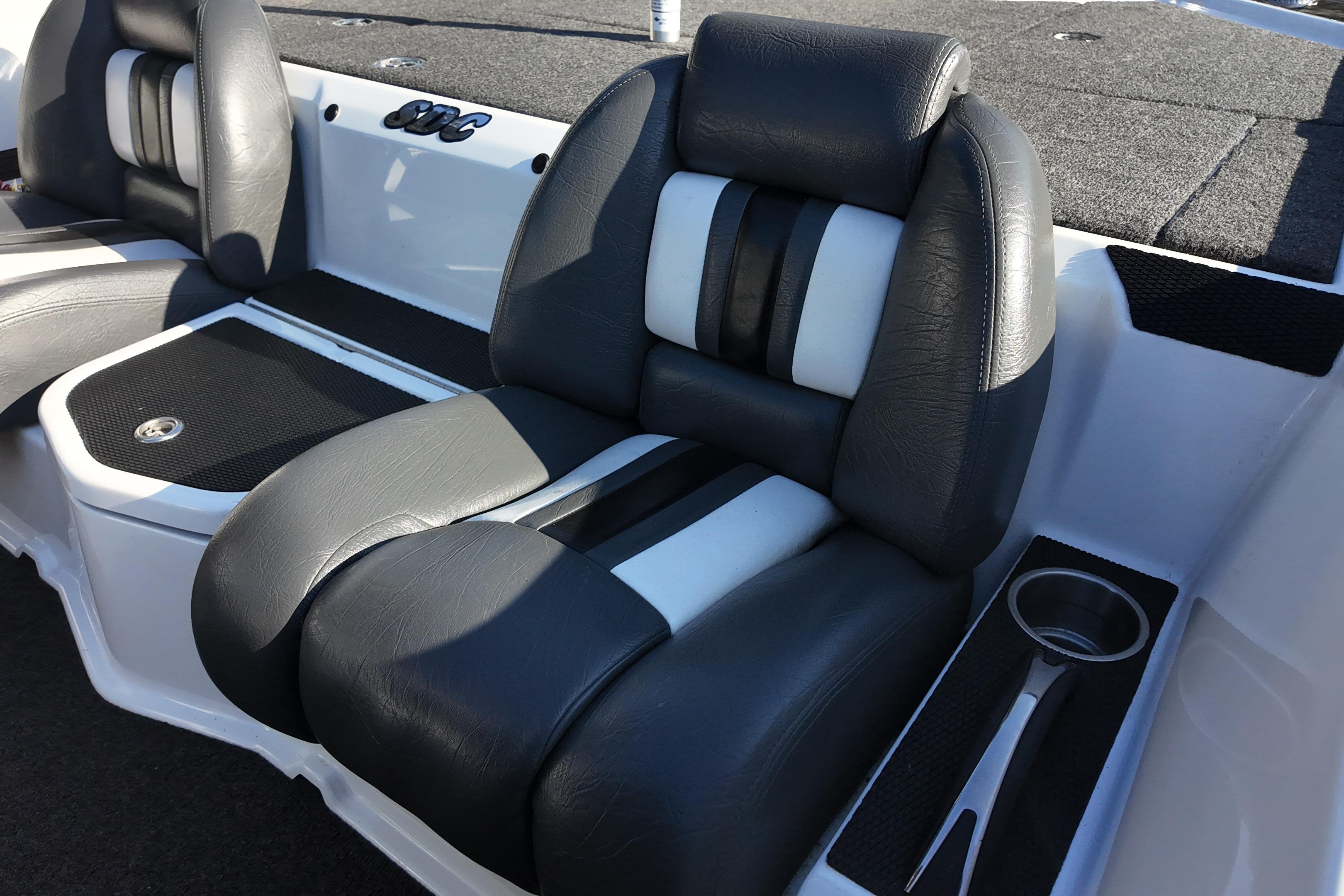 Luxurious seating in 2022 Bullet 21SDC boat, featuring sleek black and white upholstery.