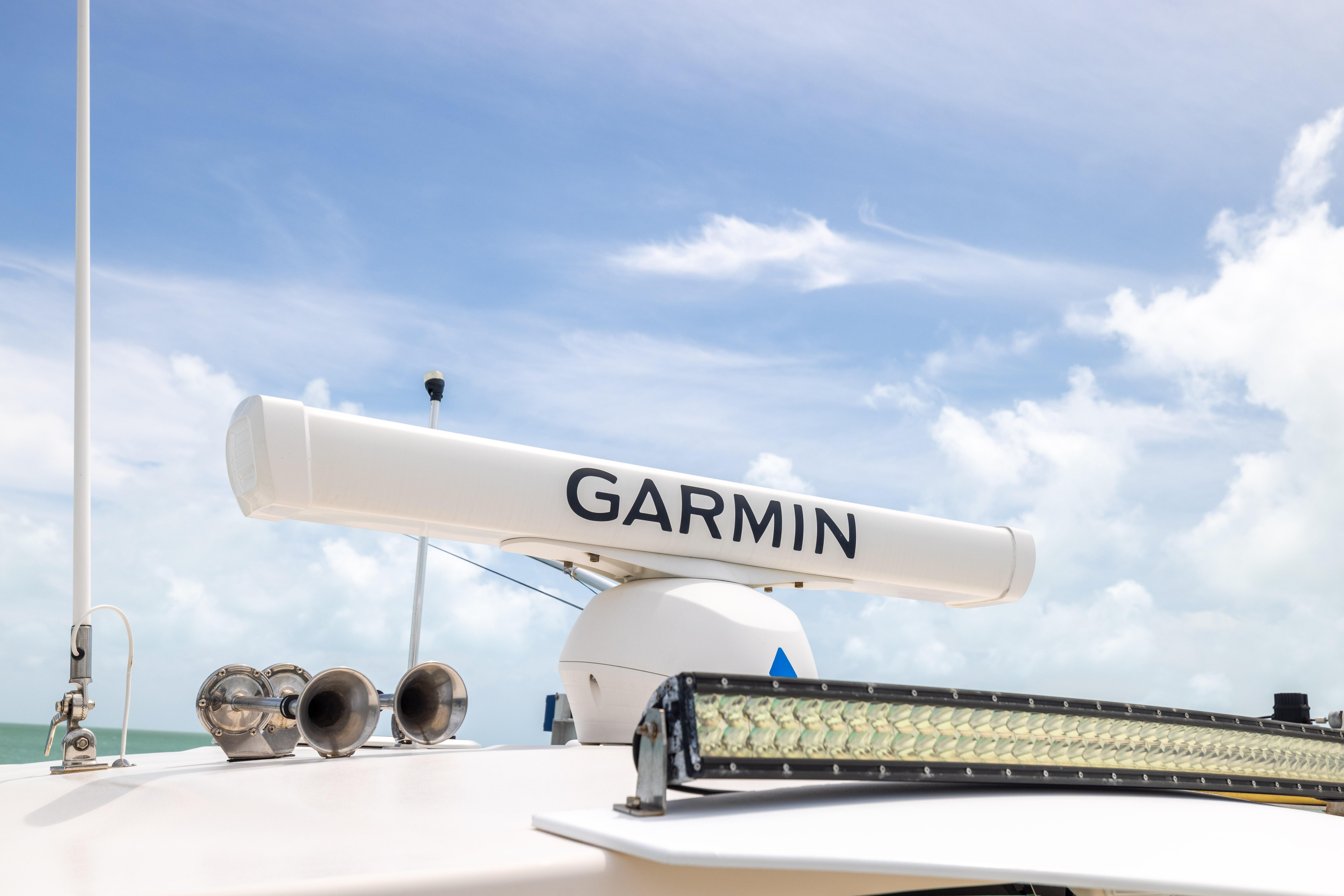 Garmin radar on 2021 Grady-White Canyon 376 boat under clear sky.