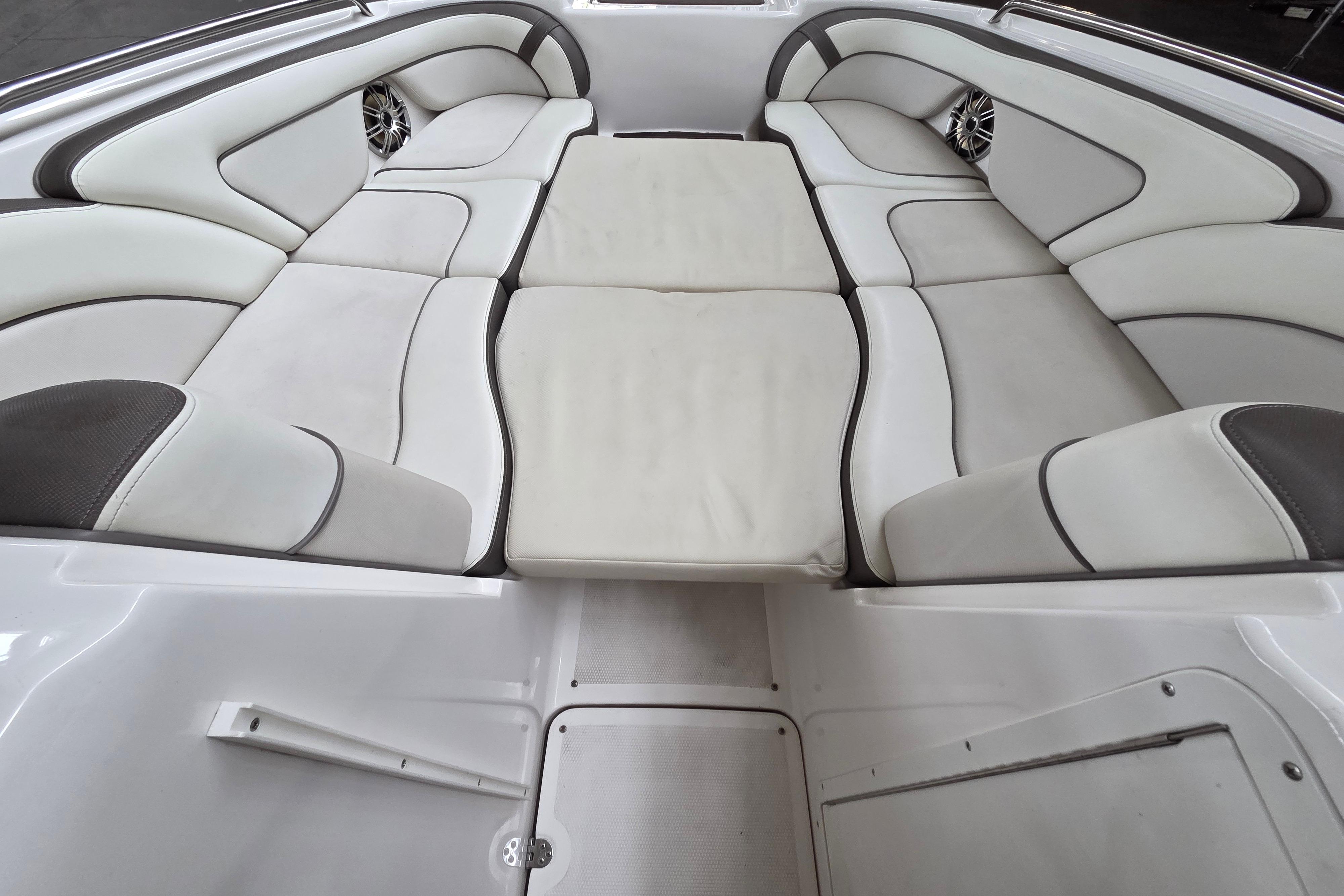 2013 Yamaha 242 Limited S boat interior with cushioned seating and sleek design.