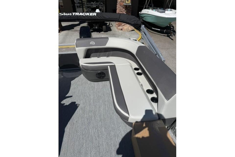 2026 Sun Tracker Bass Buggy 16 XL Select boat interior with cushioned seating and cup holders.