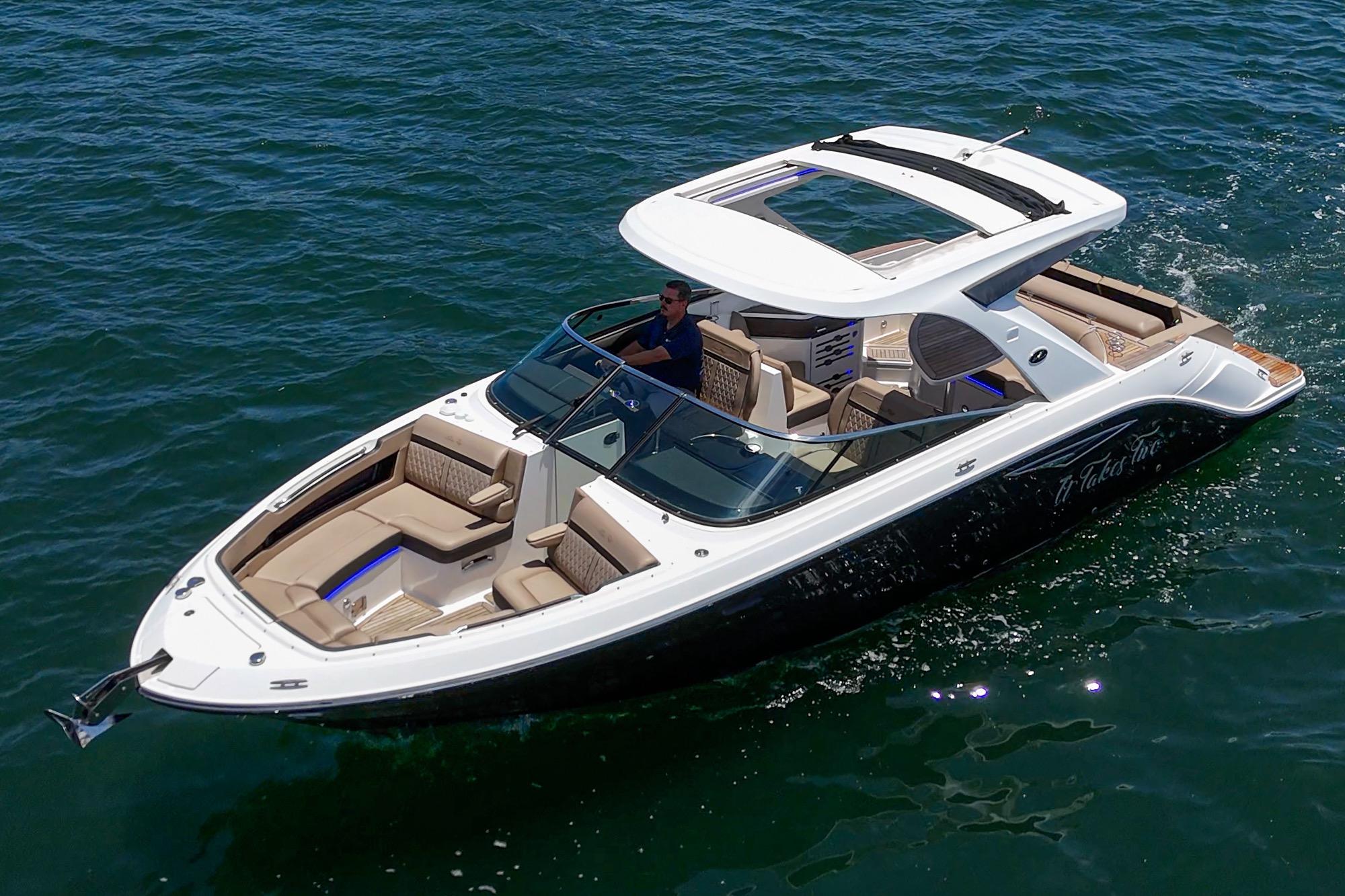 2018 Sea Ray SLX 310 boat cruising on clear blue water.