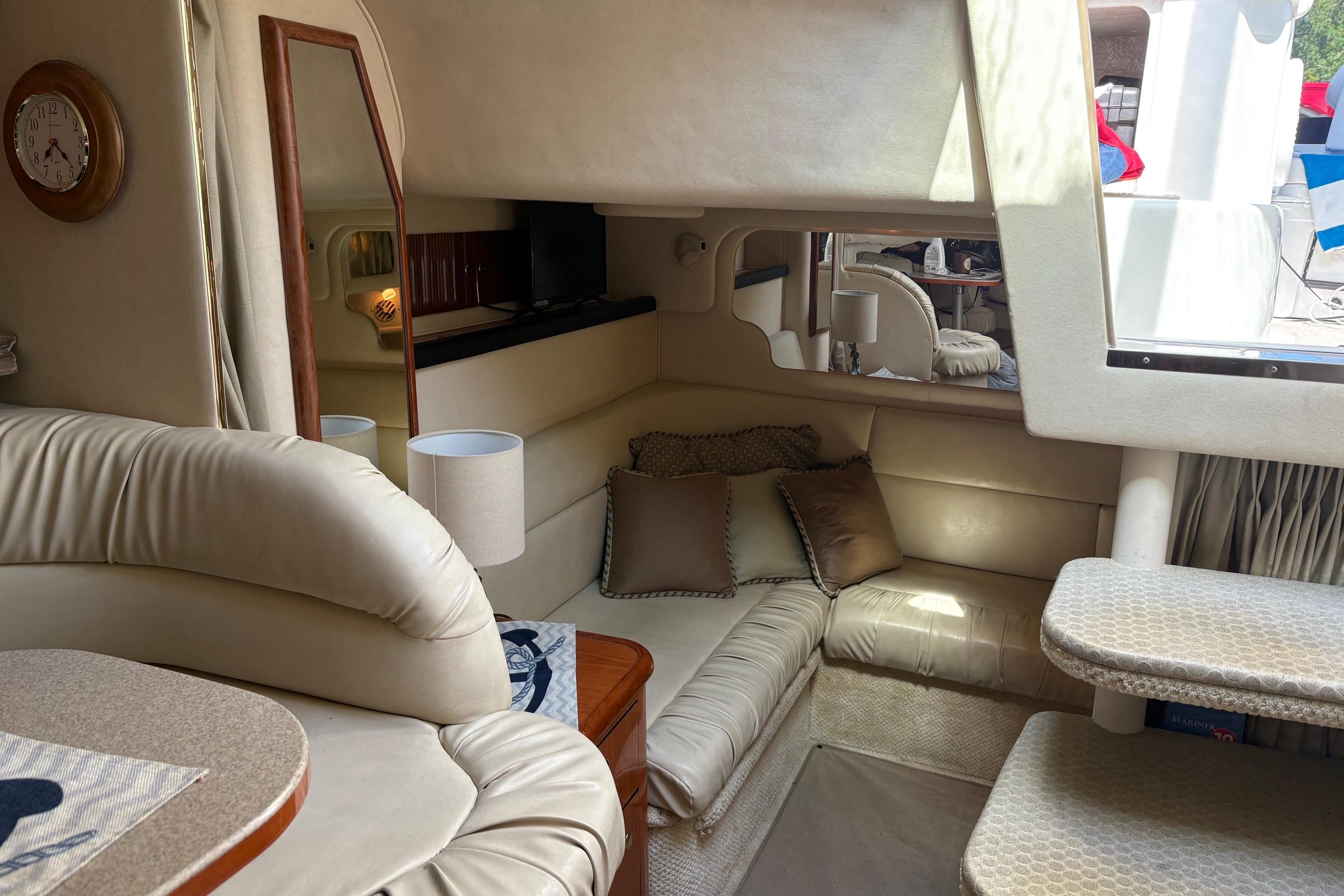 Luxurious interior of a 2001 Sea Ray 340 Sundancer yacht with plush seating.