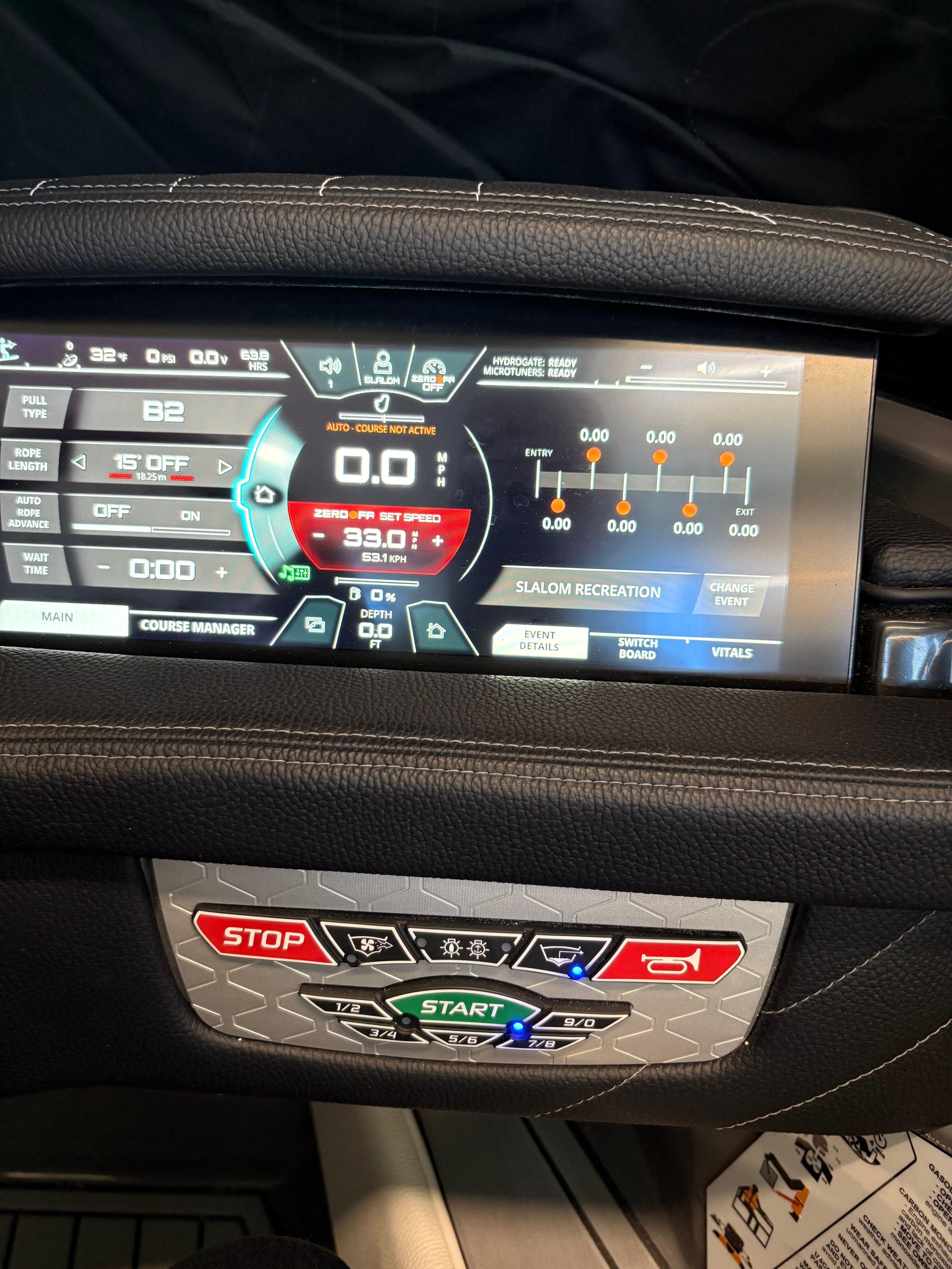 Dashboard of a 2023 Nautique Ski Nautique with digital display and control buttons.