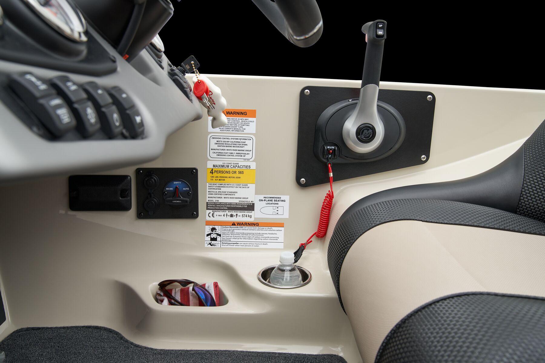 Manufacturer Provided Image: 2026 Ranger Z185 boat console with control lever and warning labels.