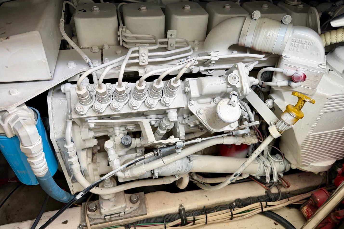 Engine compartment of a 2003 Tiara Yachts 3500 Open, showcasing detailed mechanical components.