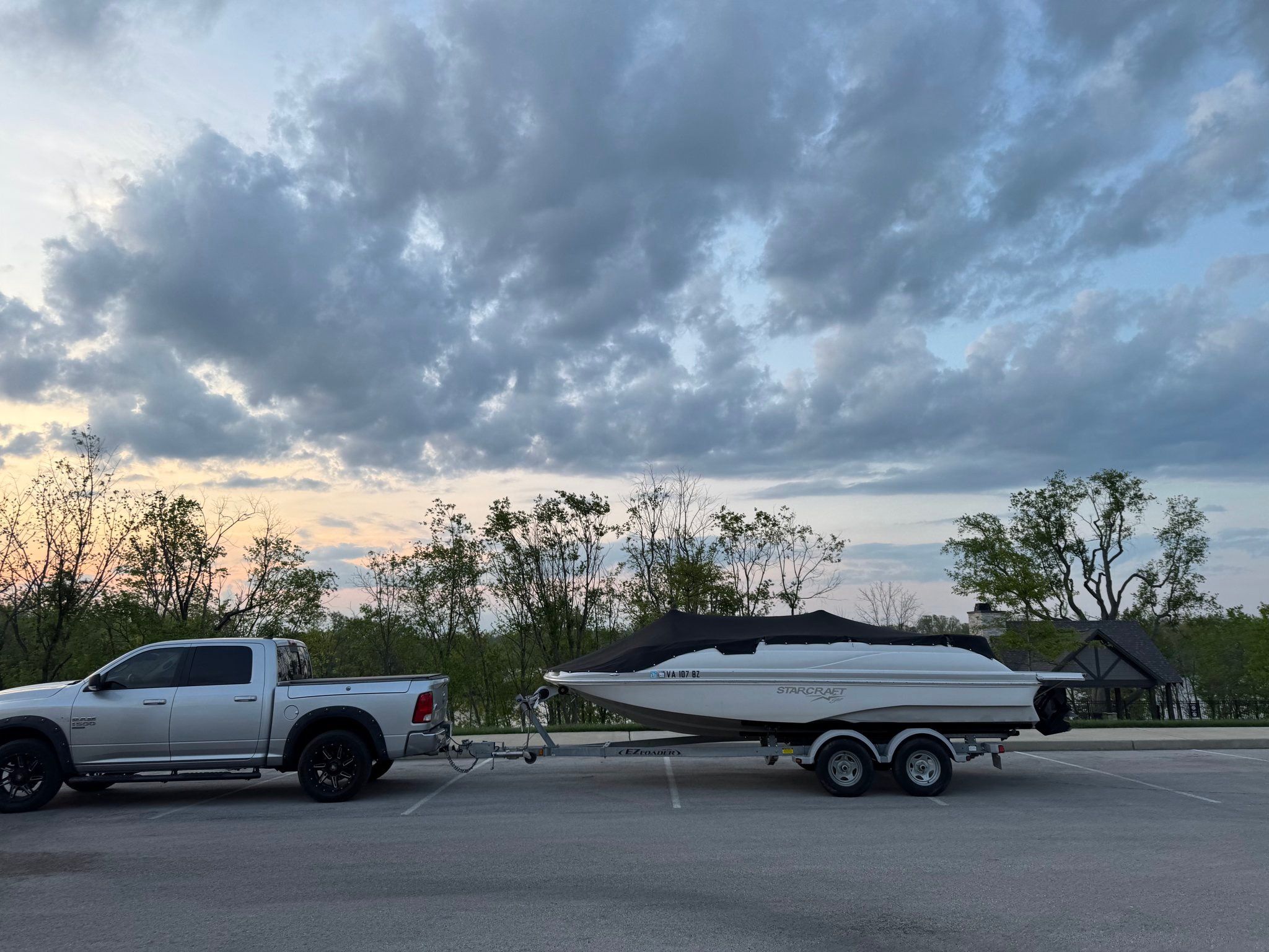 Starcraft Star Step 220 I/O boat on trailer at sunset.