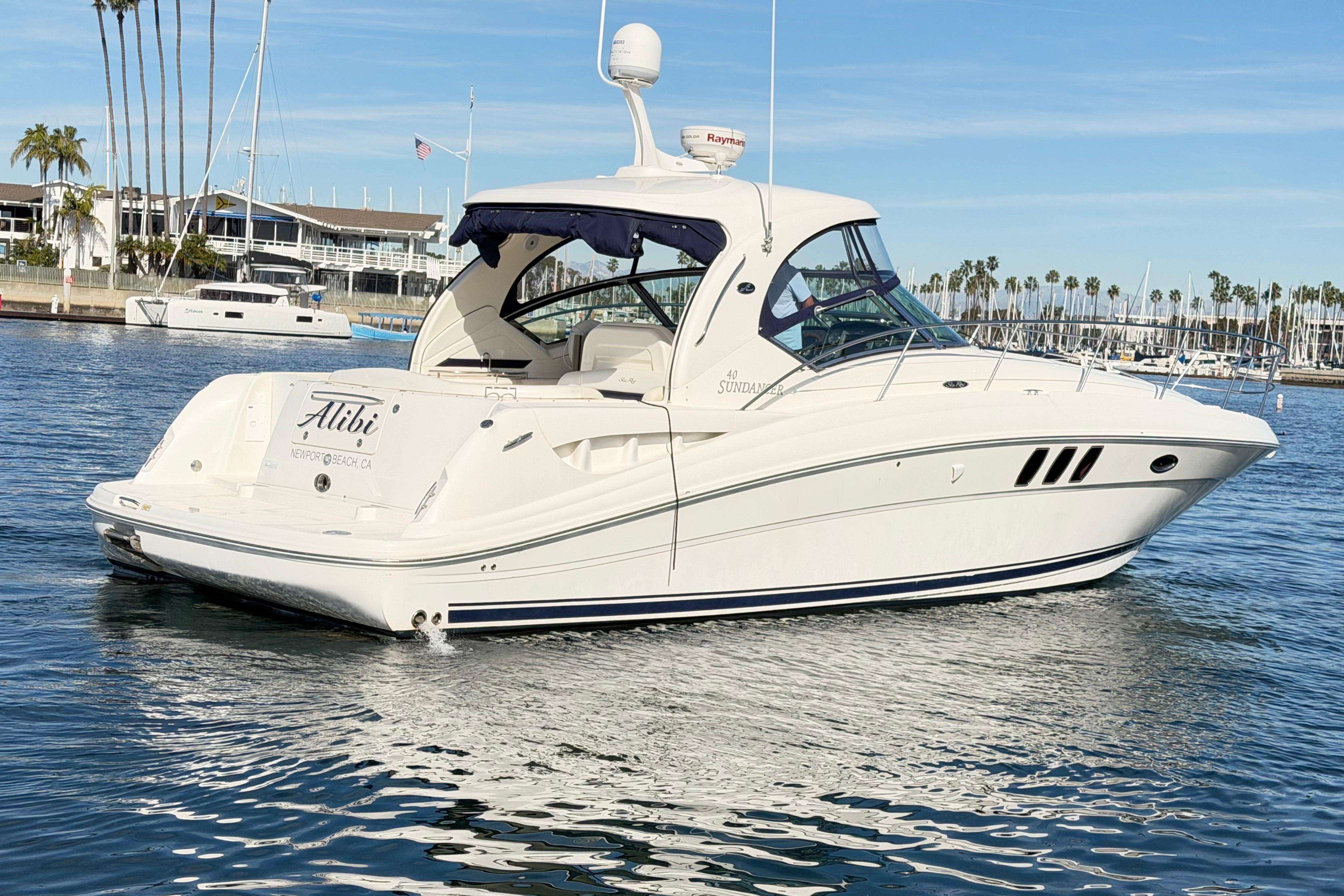 2008 Sea Ray 40 Sundancer yacht on calm water, Newport Beach, CA.