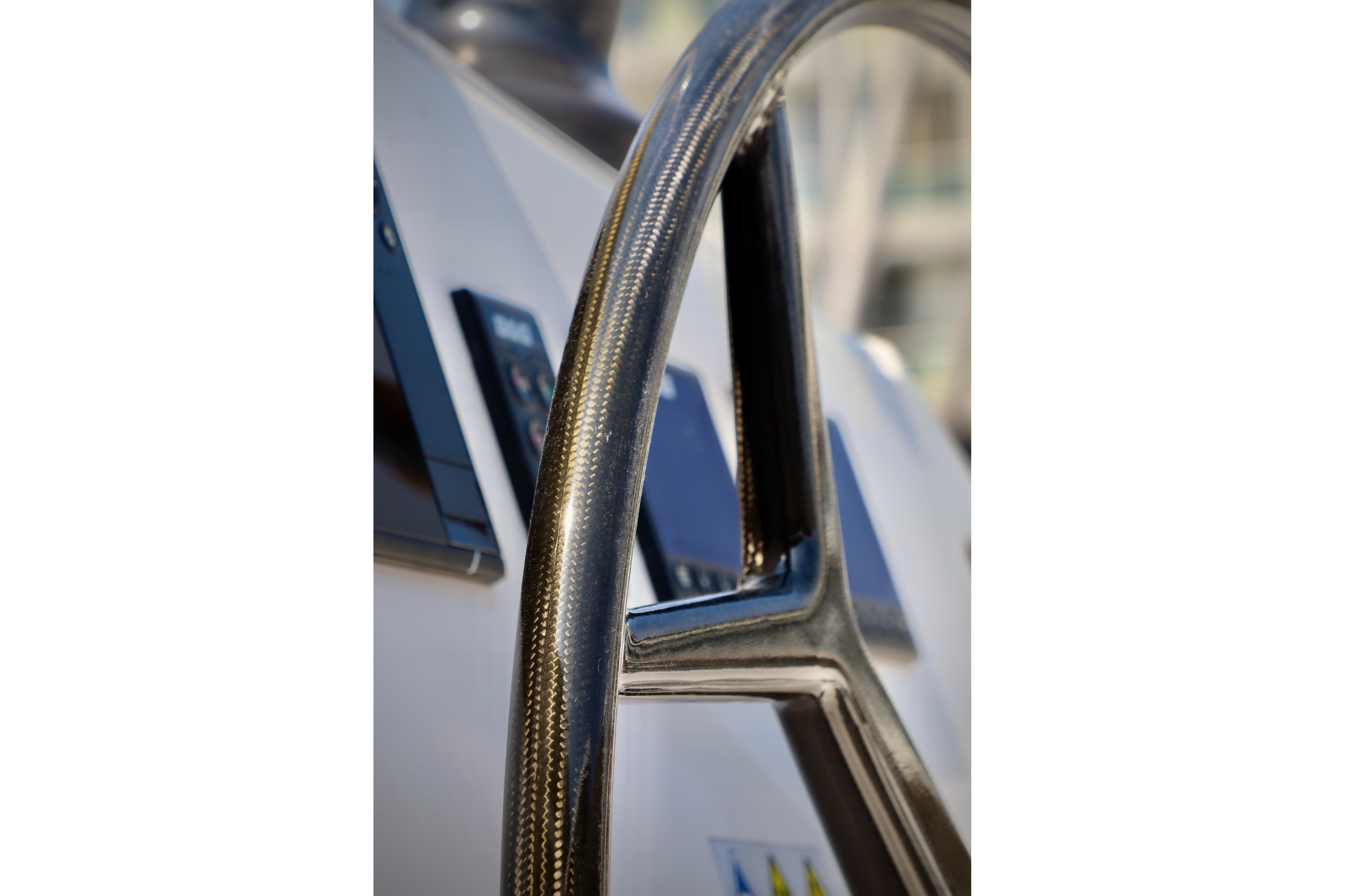 Close-up of 2017 Outremer 51 yacht steering wheel, showcasing sleek design.