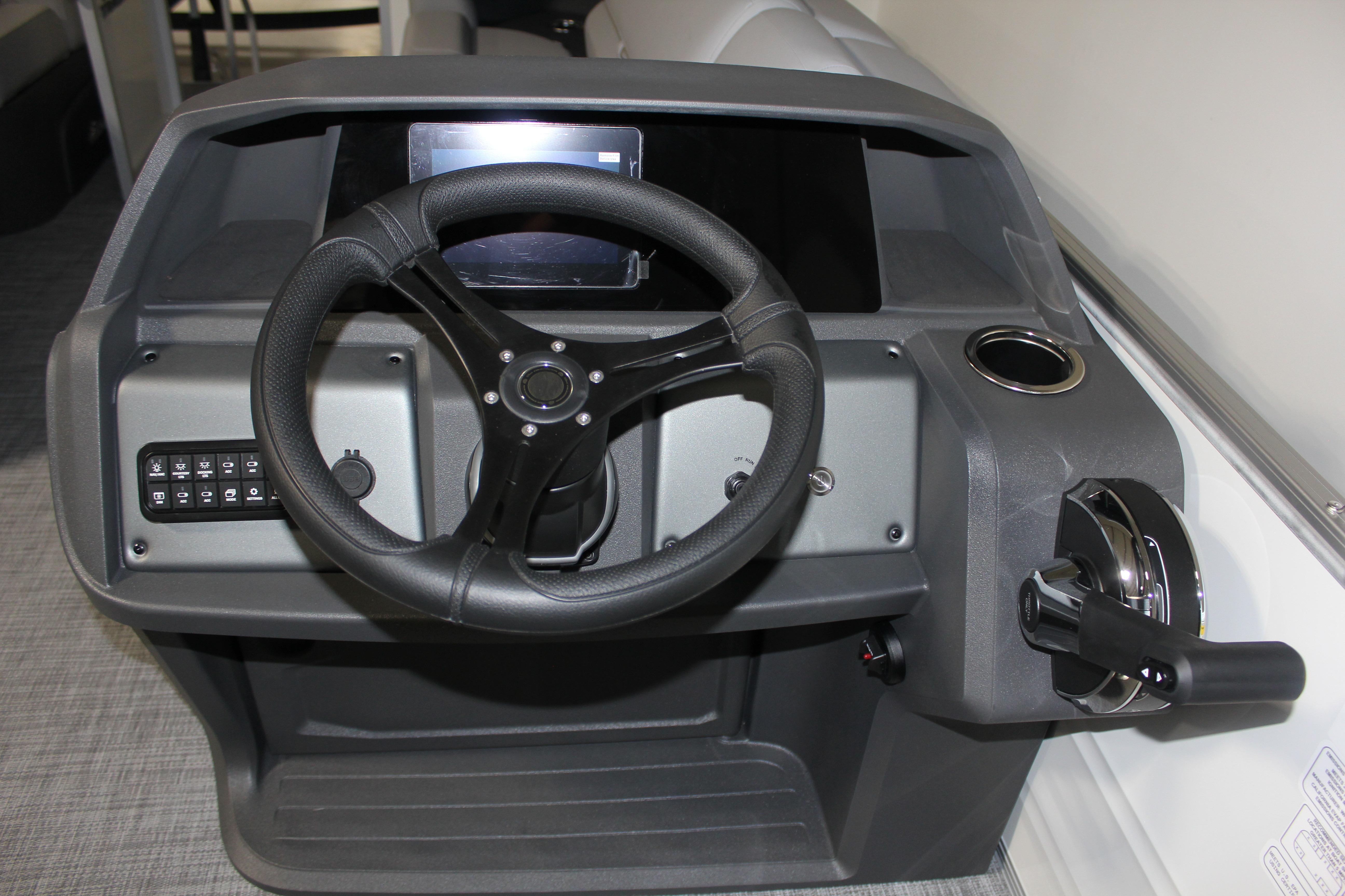Steering console of 2026 Sun Tracker Party Barge 22 DLX pontoon boat.