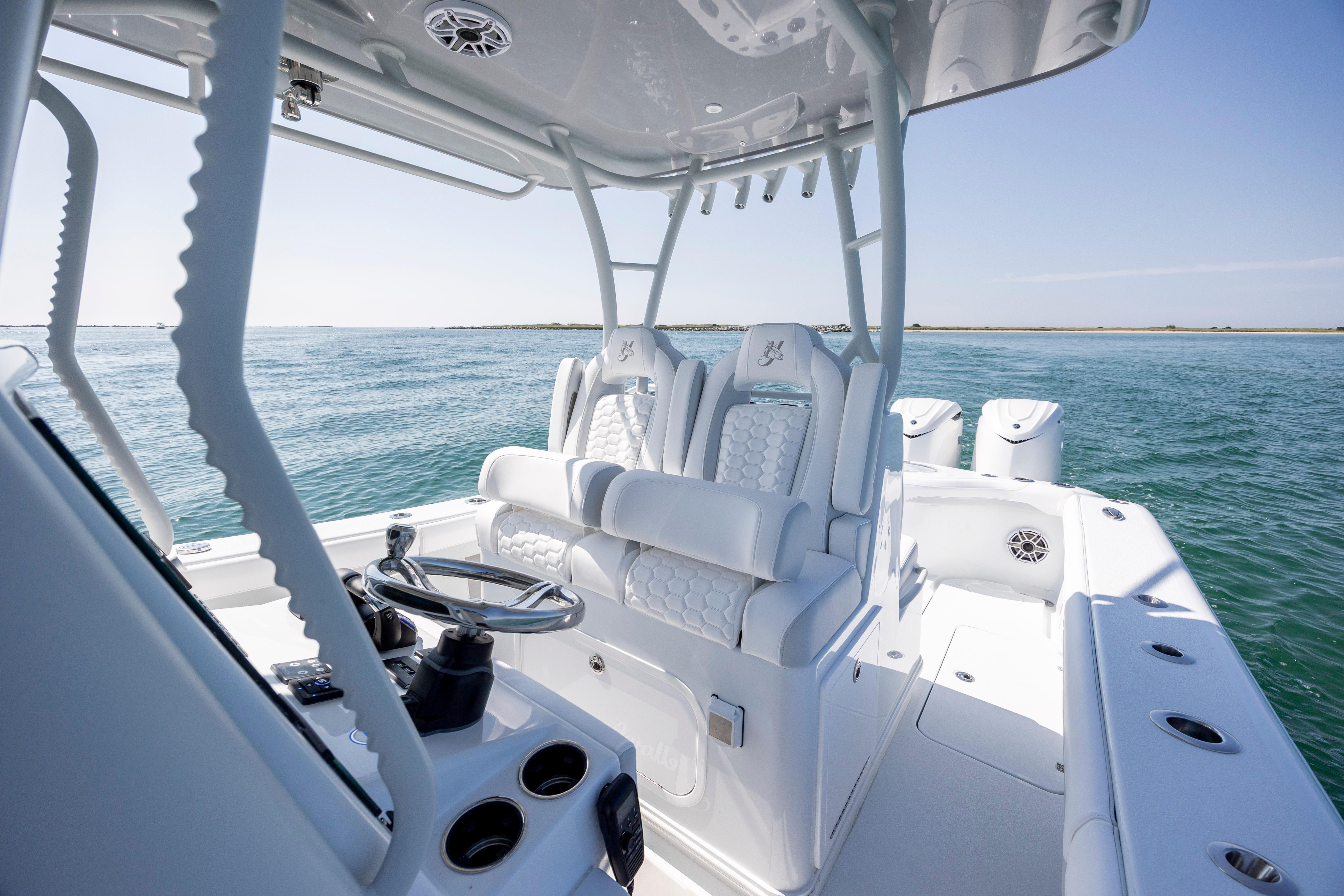 2026 Yellowfin 36 Offshore boat interior with luxurious seating and ocean view.