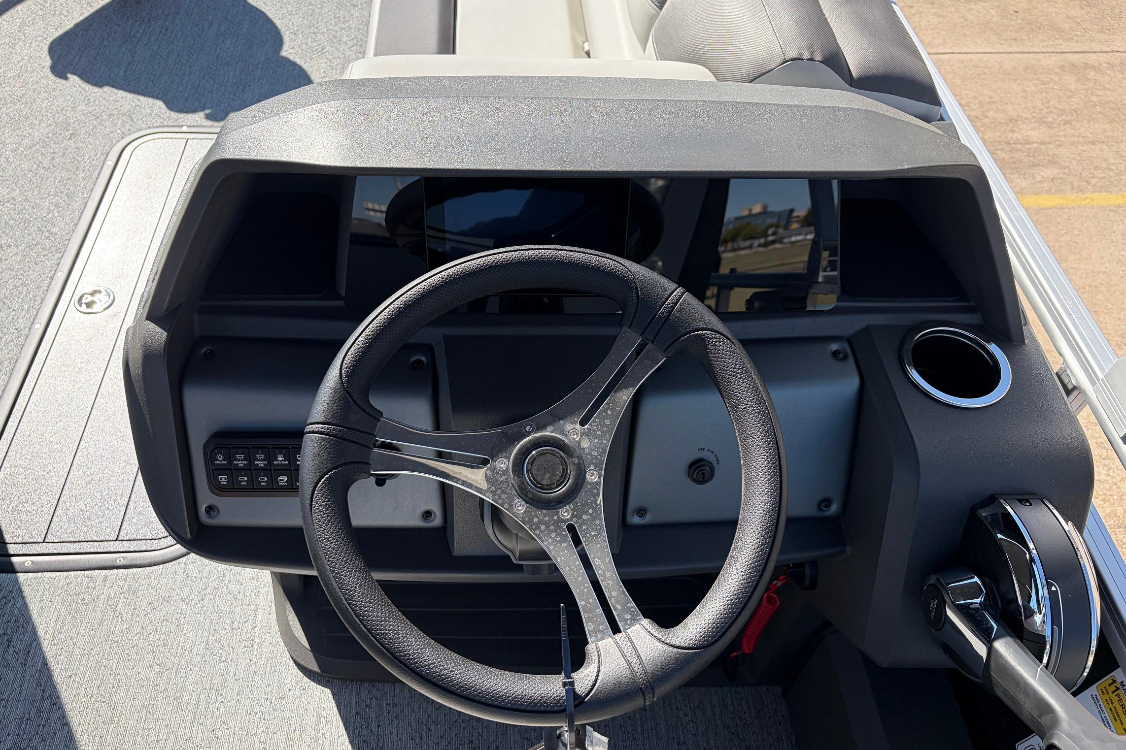 Steering console of 2026 Sun Tracker Fishin' Barge 22 XP3 pontoon boat.