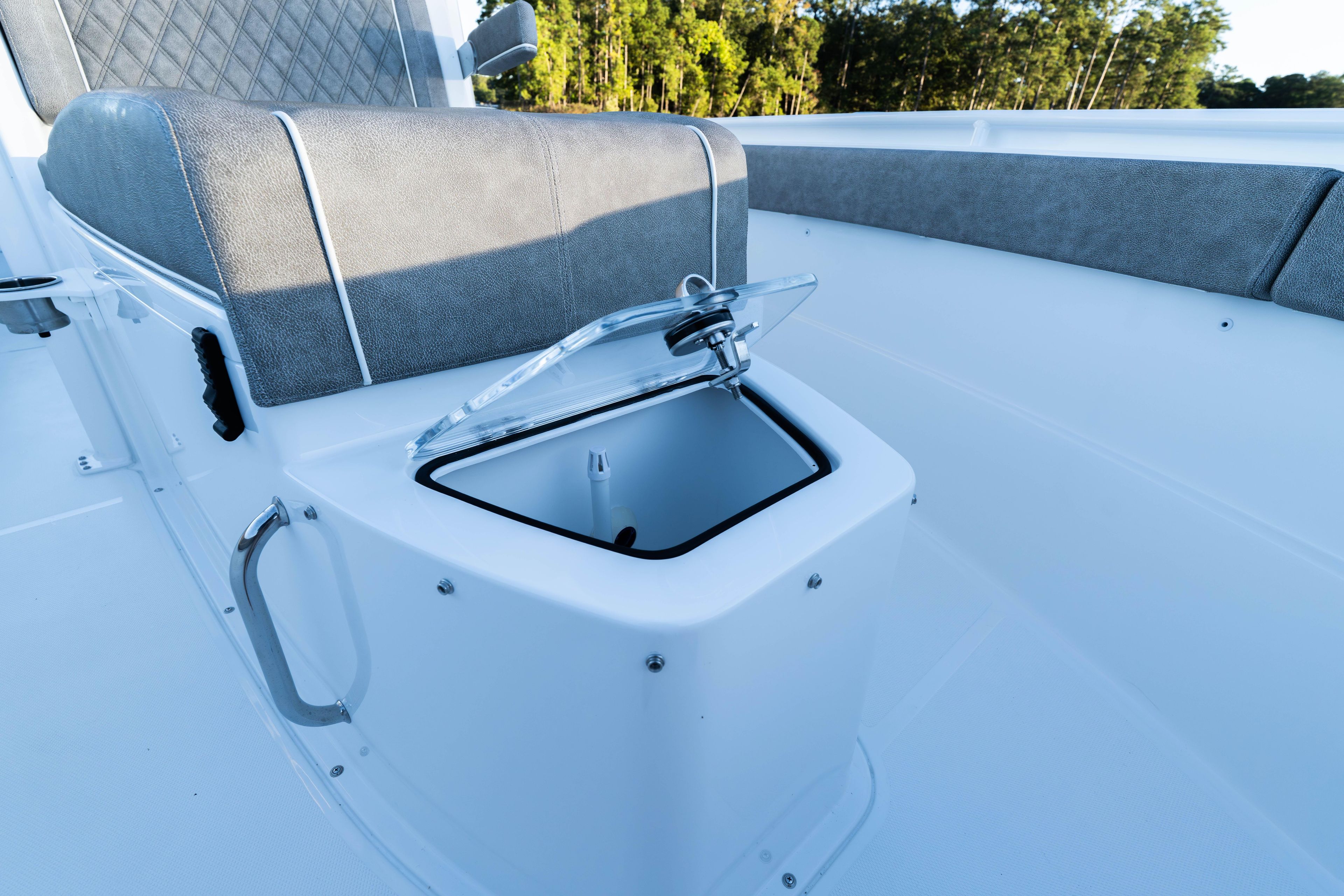 2026 Sea Hunt Ultra 275 Coffin Box with open storage compartment and cushioned seating.