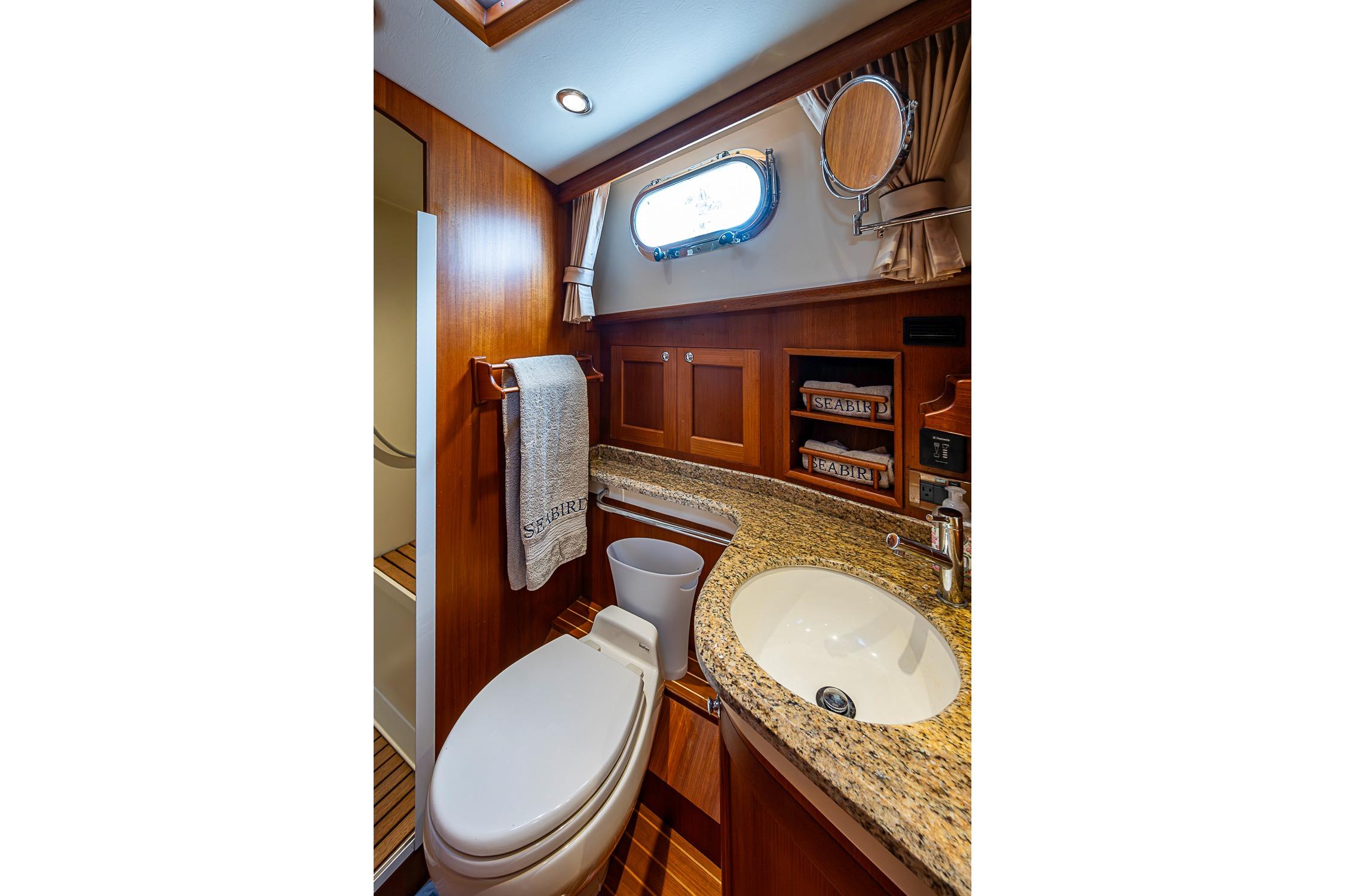 Luxurious bathroom in 2014 Grand Banks 46 Eastbay SX yacht with granite countertop.