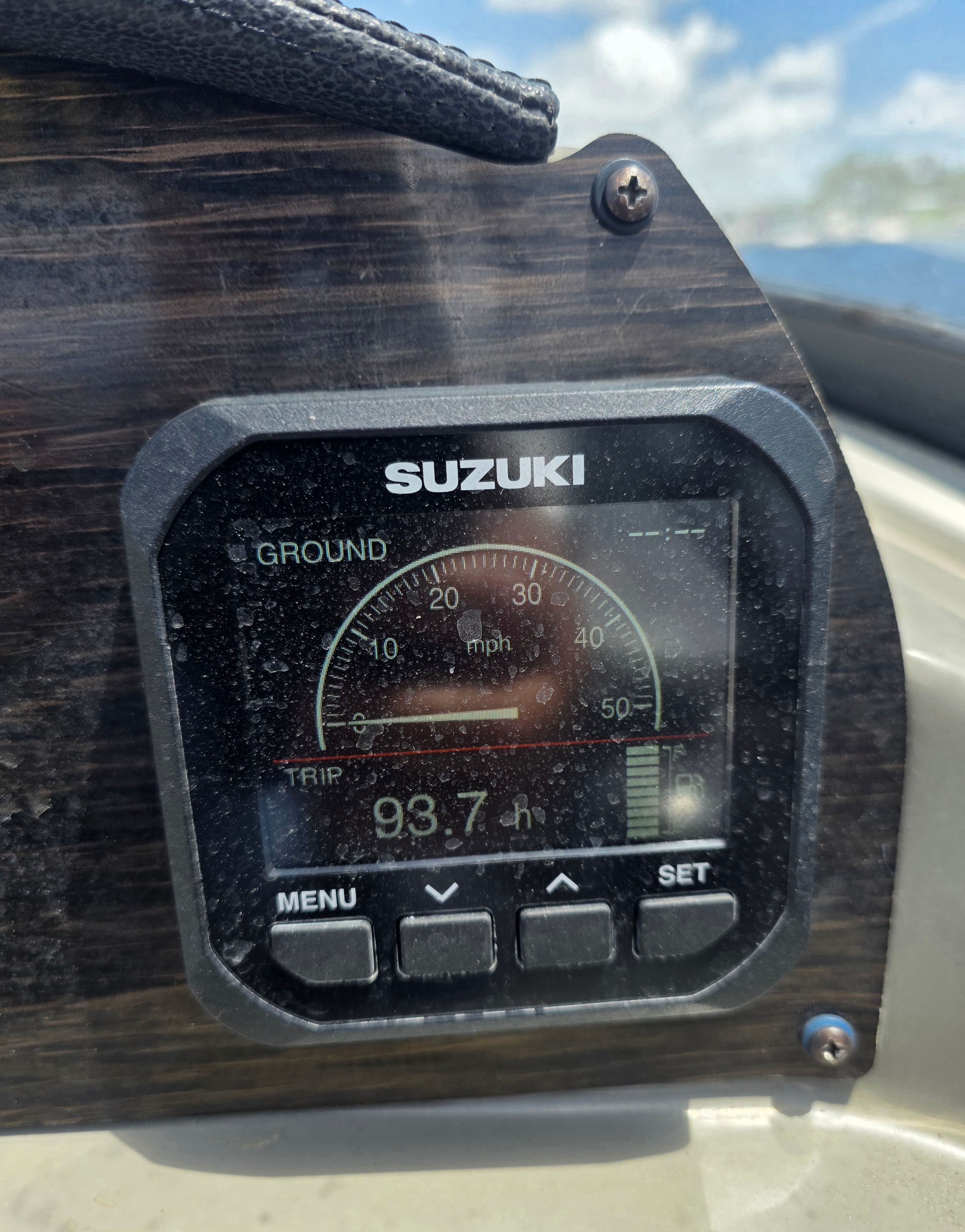 Close-up of a Suzuki boat display showing speed and engine hours.