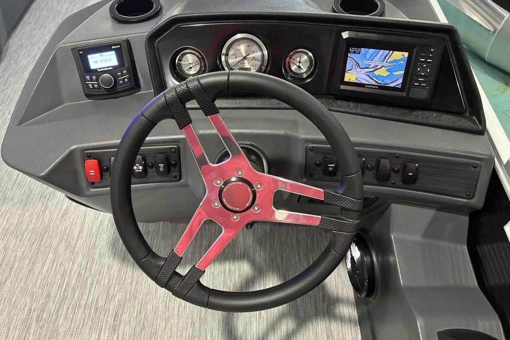 Steering console of 2026 Bennington SWINGBACK 22 with modern controls and navigation display.