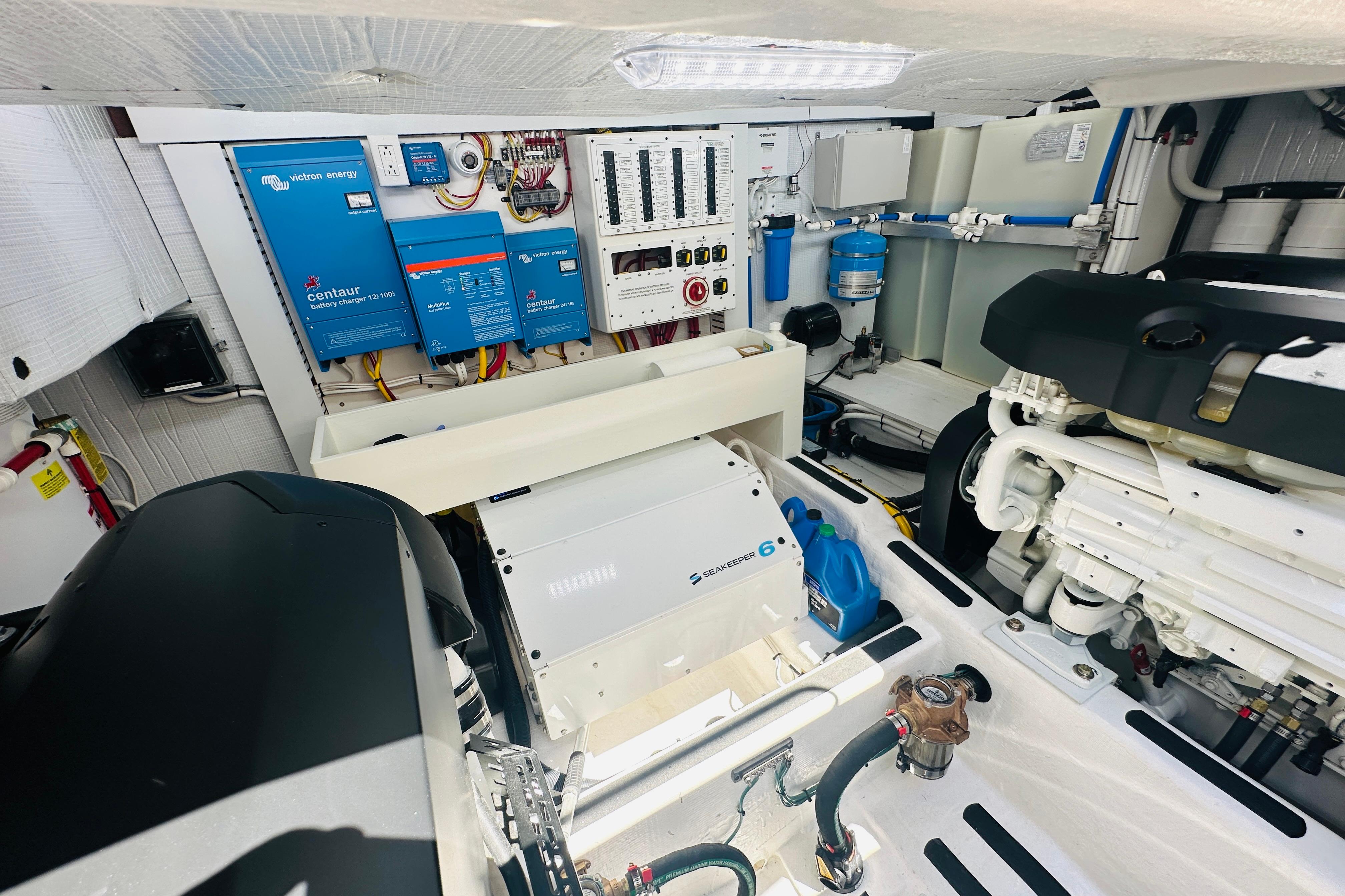 Engine room of 2025 Sabre 48 Salon Express, featuring advanced electrical systems and components.