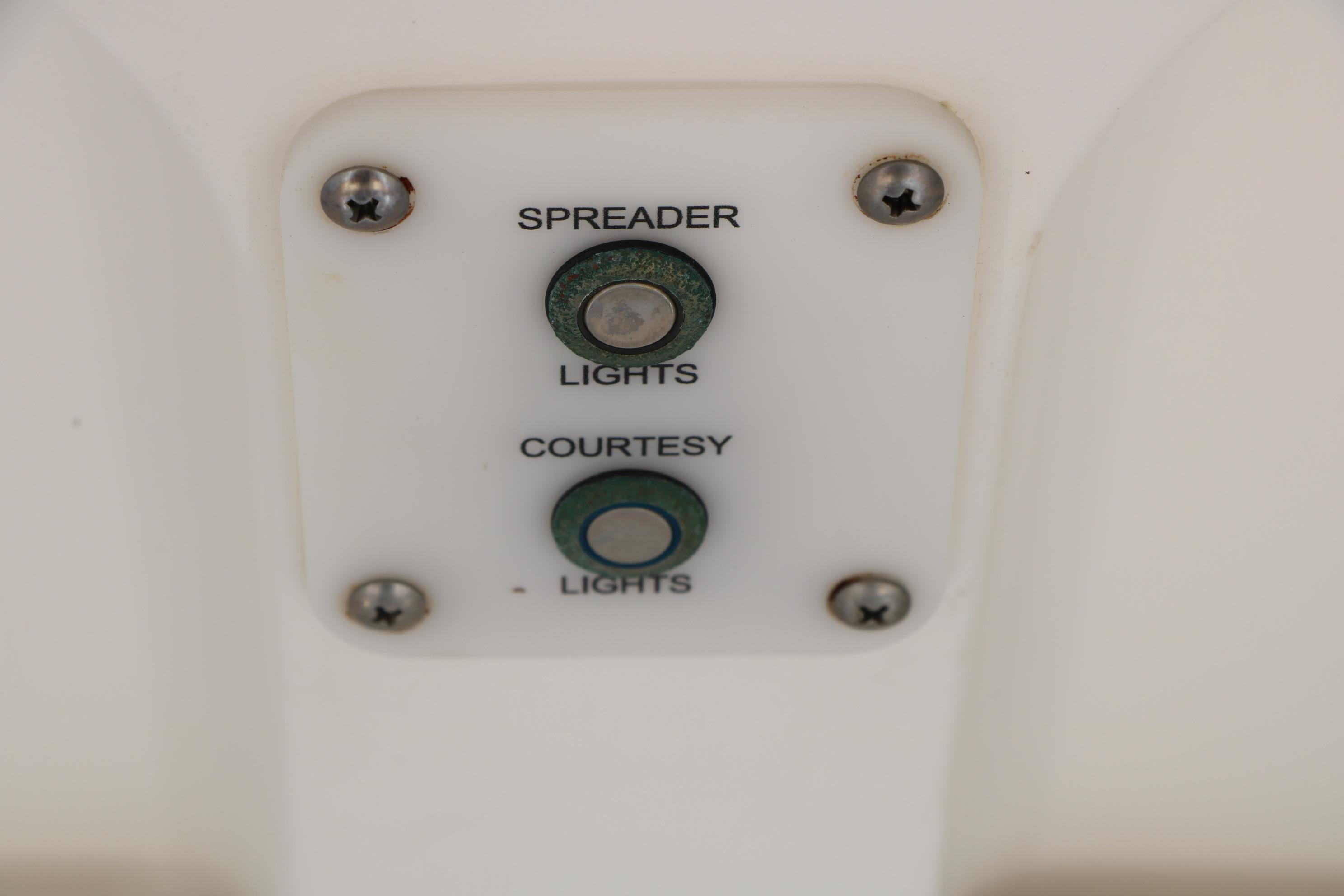 2015 Sea Hunt BX 22 BR boat light switches for spreader and courtesy lights.