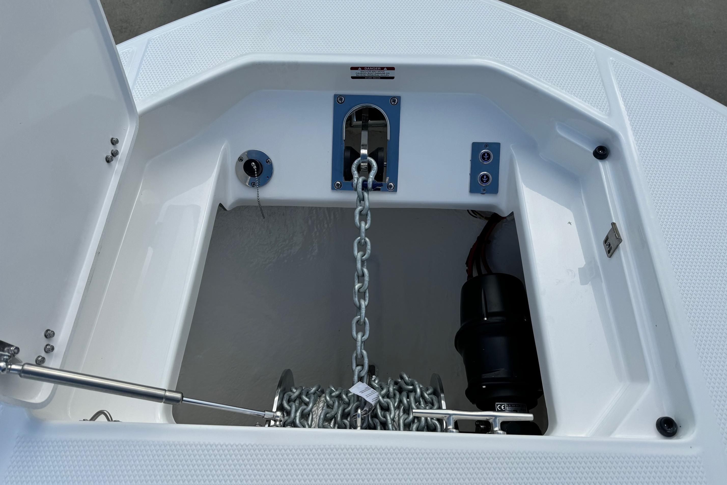 2025 Robalo R360 Center Console anchor locker with chain and winch system.
