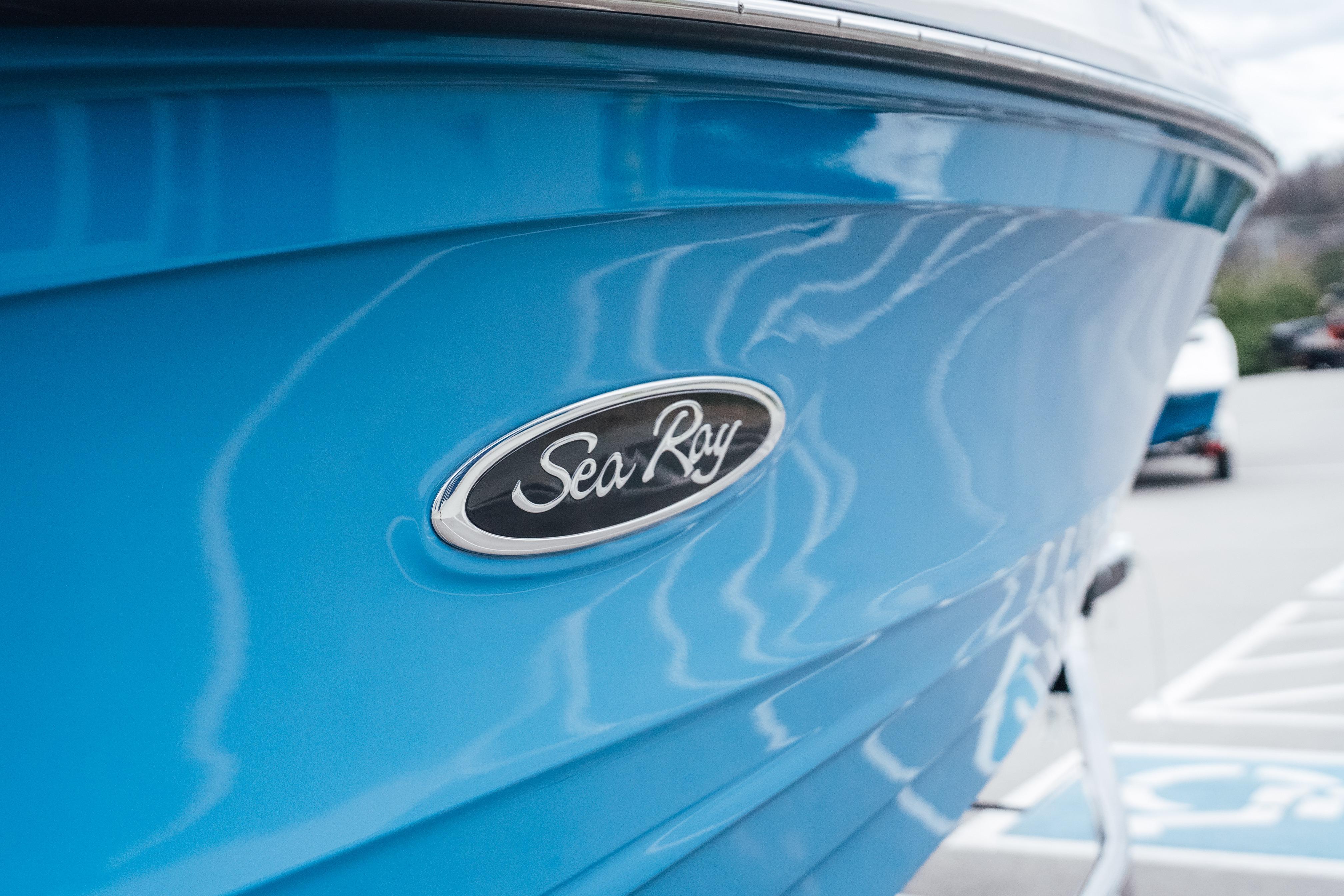 2023 Sea Ray SPX 230 boat with blue hull and logo detail.