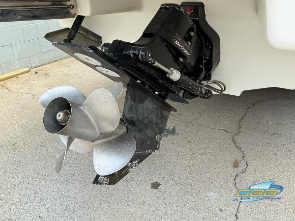 2008 Sea Ray 270 SLX boat propeller and outdrive on concrete surface.