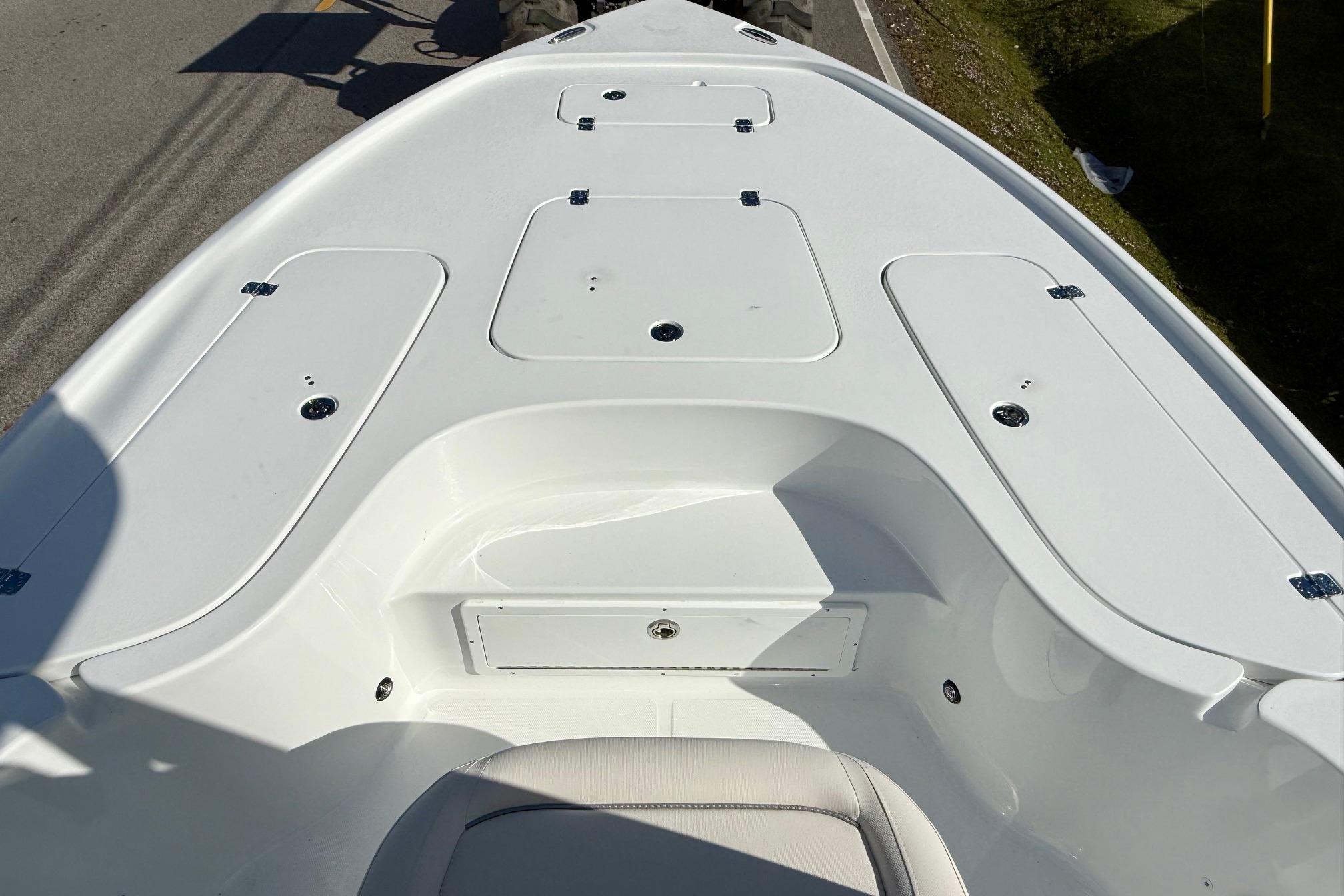 2026 Sea Hunt BX 22 BR boat deck with storage compartments and seating.